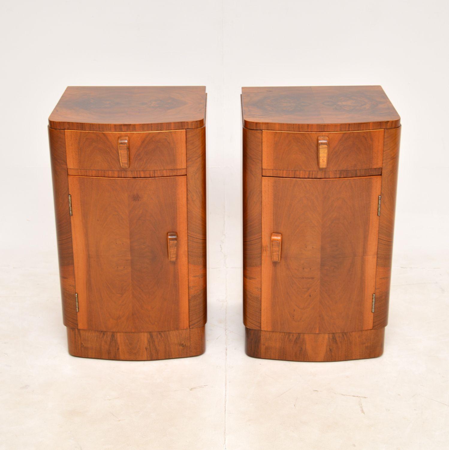 A beautifully made pair of original walnut Art Deco period bedside cabinets. They were made in England, they date from the 1930’s.

Made from richly figured walnut, the colour and grain patterns are lovely. They are a very useful size and offer