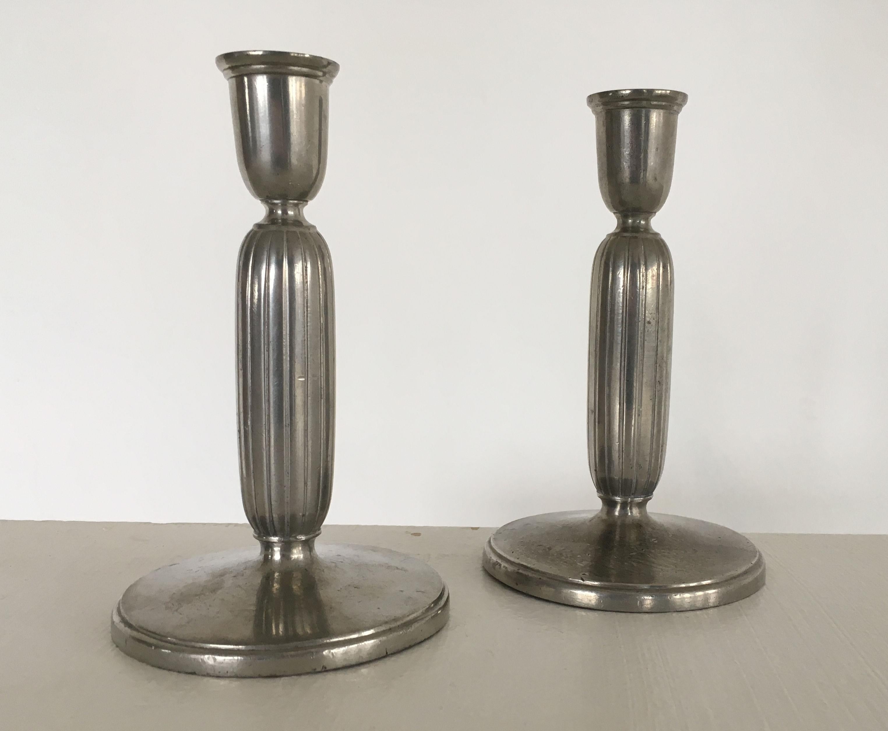 Pair of Art Deco pewter candlesticks by Just Andersen

The candlesticks are in good vintage condition.

Marked Just. A. no, 2574. H.

 