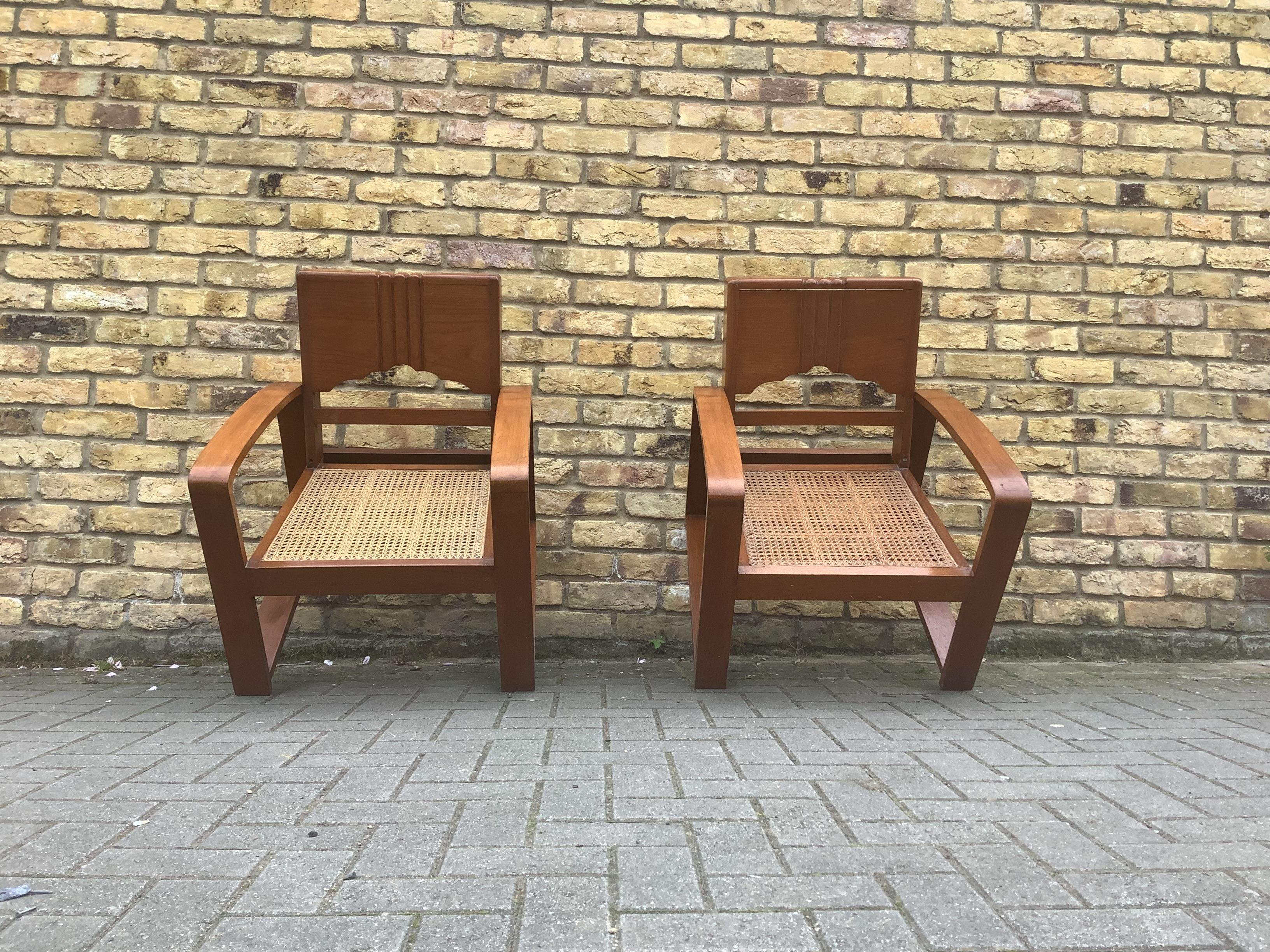A Pair of Anglo -Burmese teak wood chairs,with cane seating curved deco styling
In good vintage condition wonderful rare pieces 
circa 1930.
