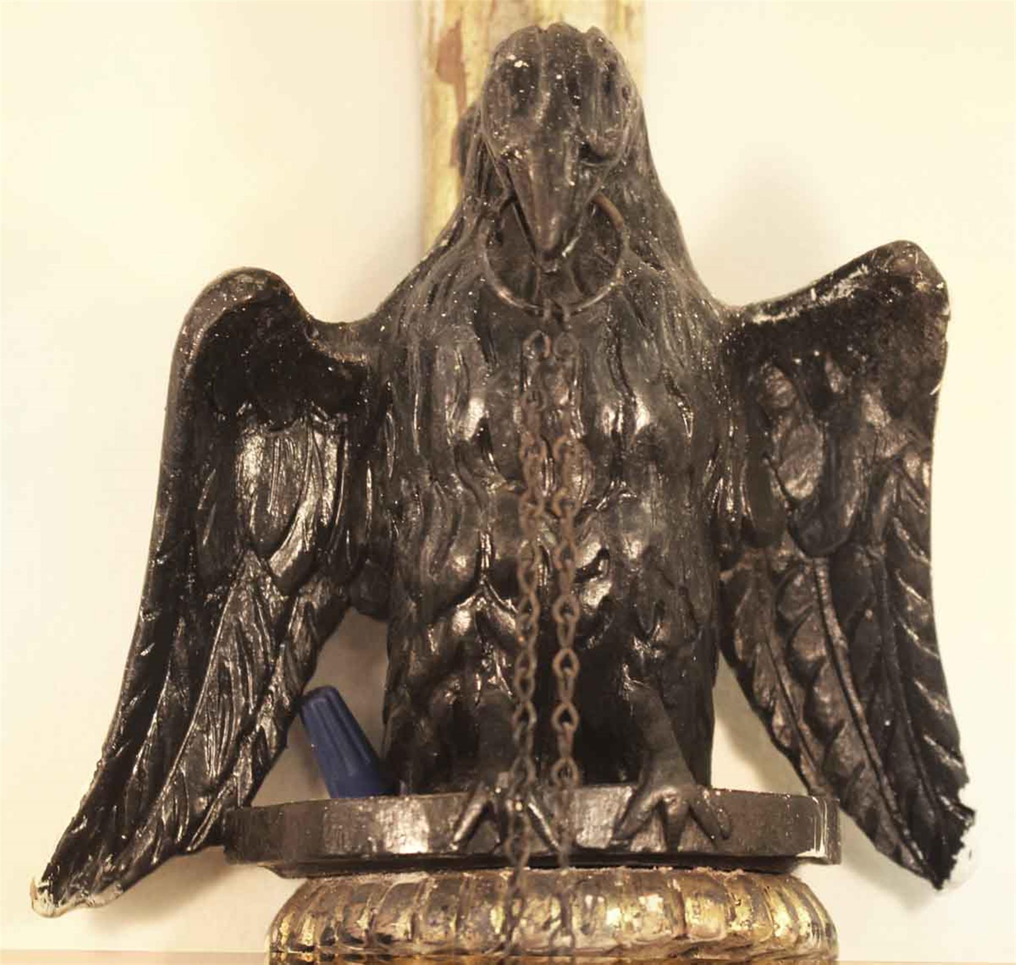 1930s carved gilt wooden two-arm sconces with eagle and cherub motif. The condition of the wood is good, but the gilding is worn. Priced per pair. Two pairs available at time of posting. This can be seen at our 400 Gilligan St location in Scranton,