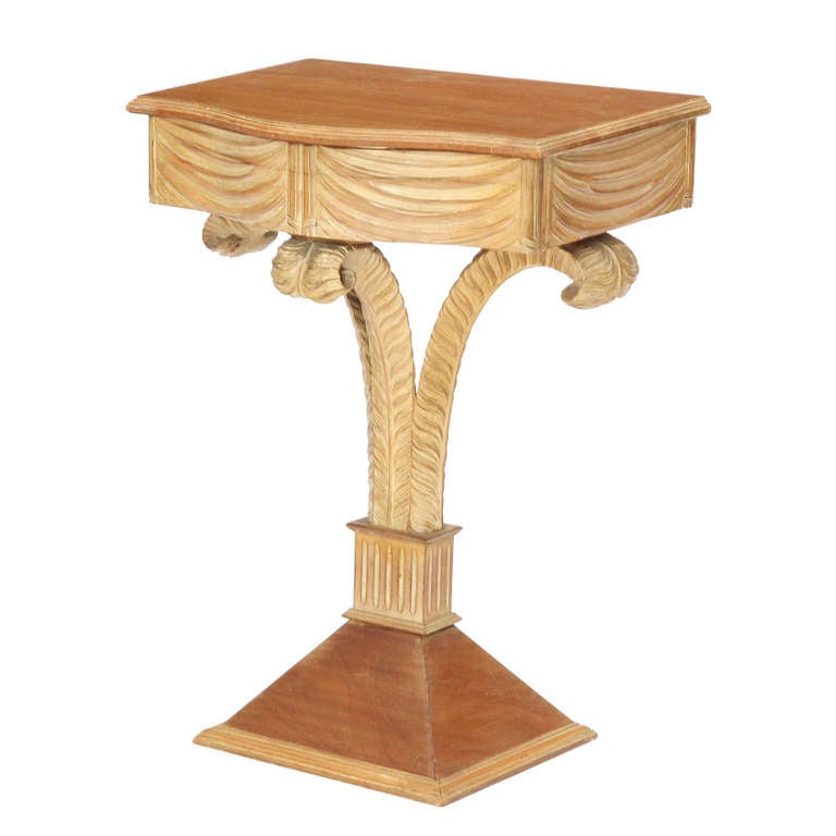 Similar in style to Grosfeld House, a pair of excellent single drawer entry consoles on pedestal bases with a flowering column and hand carved details. This model is identical to documented examples with 'Jansen' markings, circa 1939.