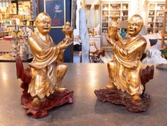 1930s Pair of Oriental Figures in Gilded Wood on Carved Pedestals