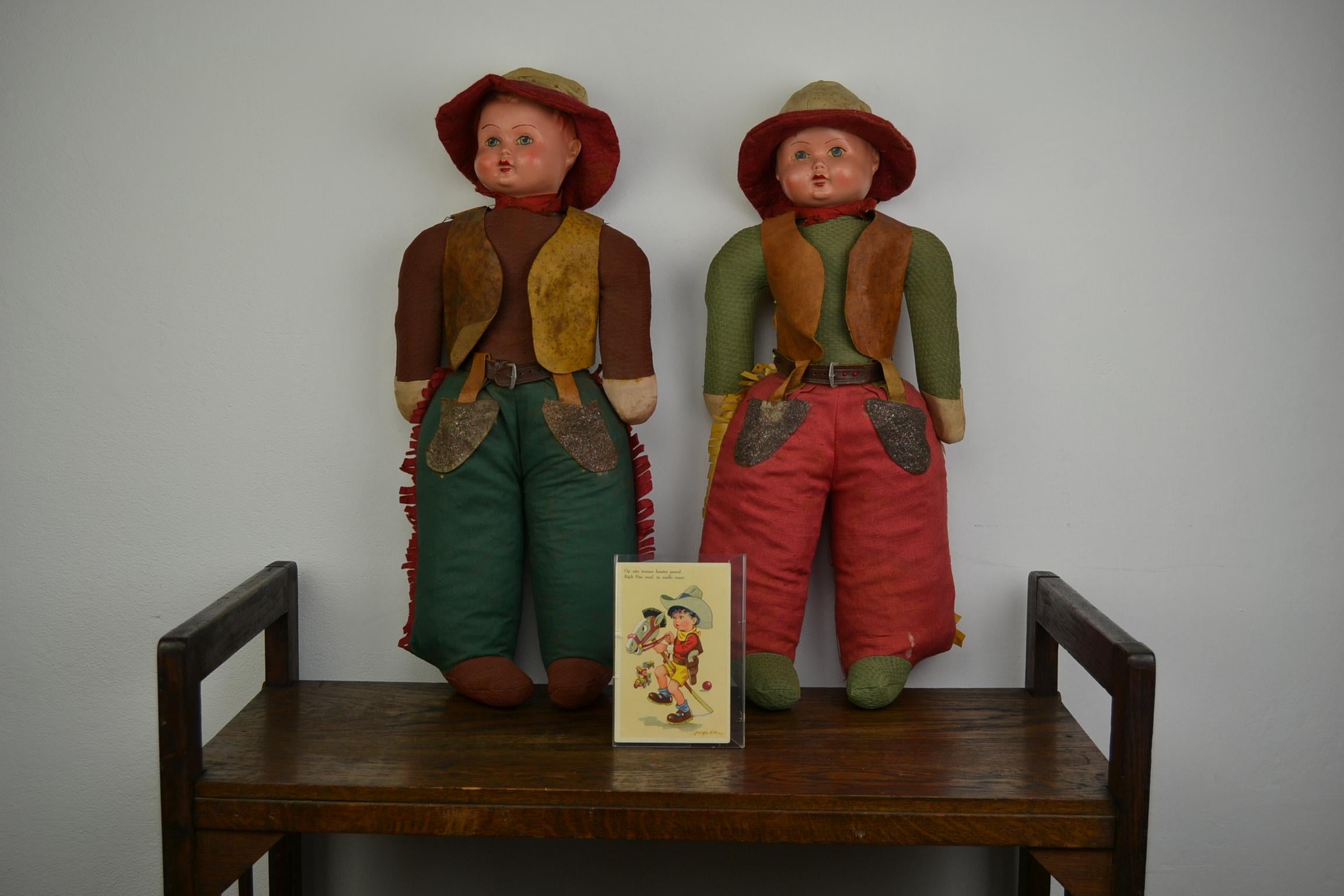 Awesome pair of Western Cowboy and Cowgirl Toy Dolls.
These two Large Dolls have a stuffed body with straw 
and heads of Composition. They date from the 1930s.
Both dolls are dressed in very detailed jackets, have leather belts, hat, western