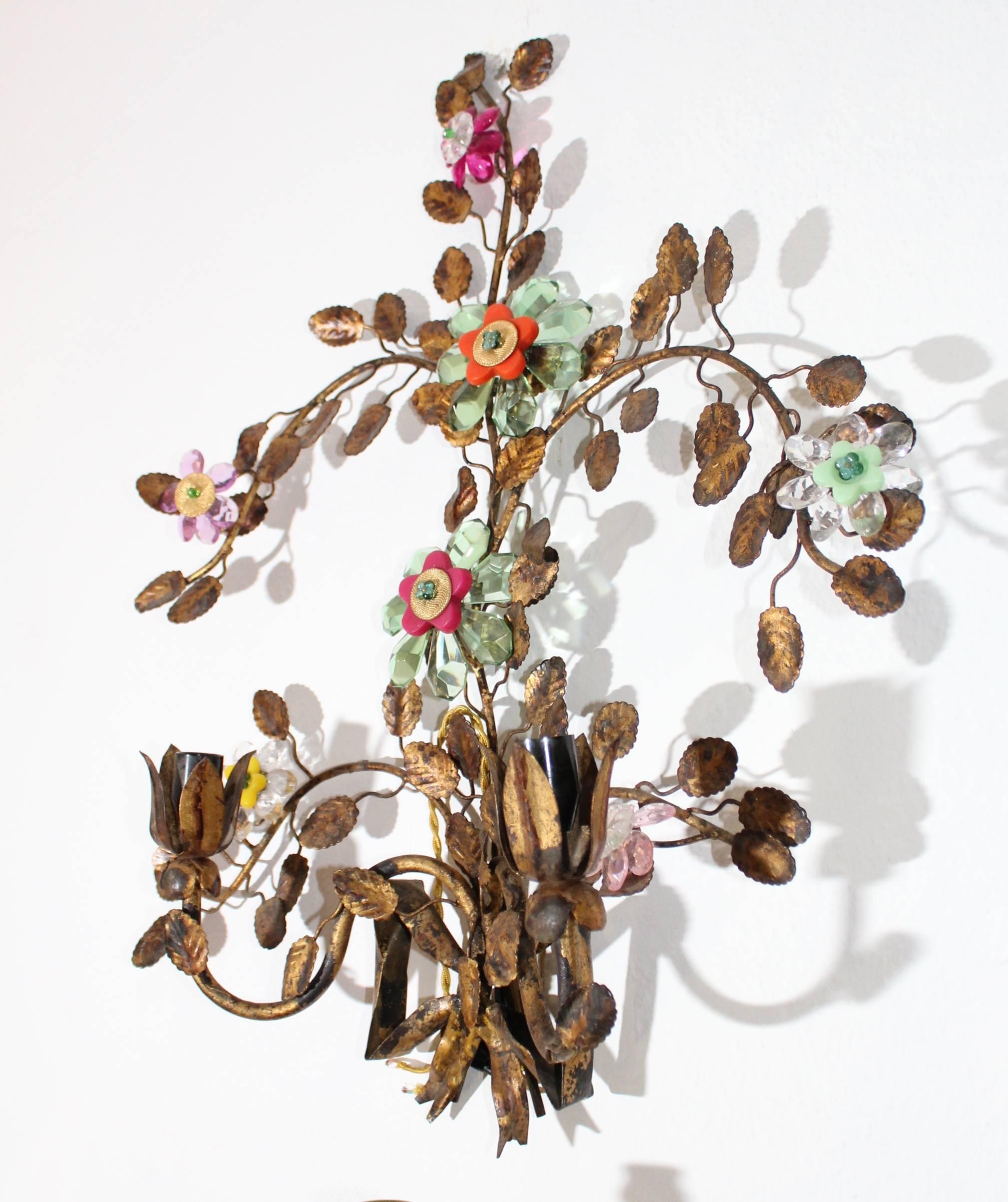 Pair of 1930s wrought iron wall lamps with leaves and flowers in coloured glass.