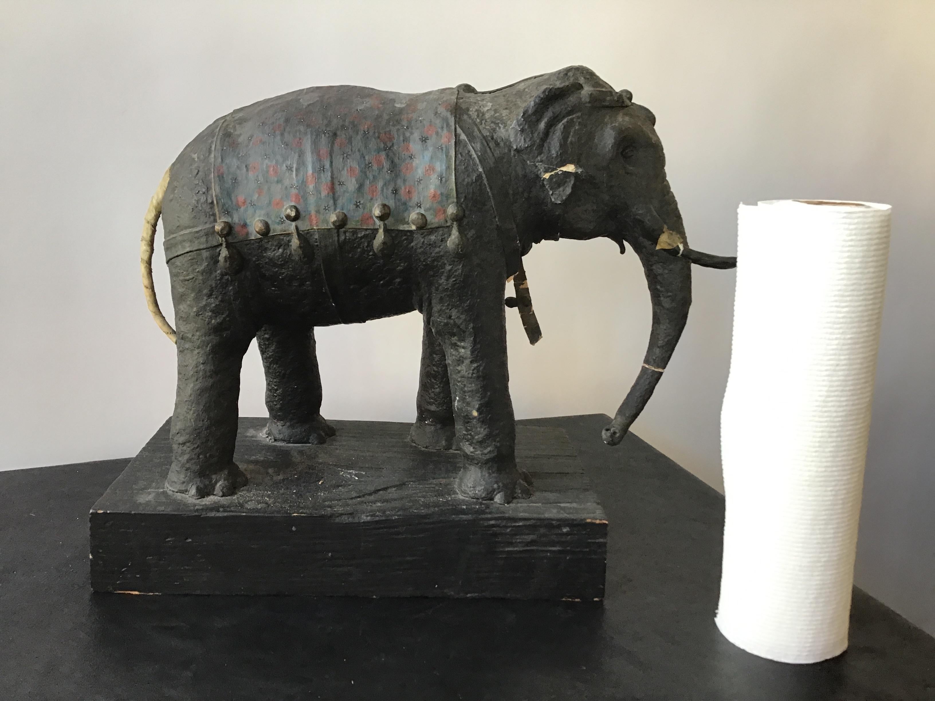 1930s papier mâché elephant on wood base. Some damage to elephant as shown in pictures.