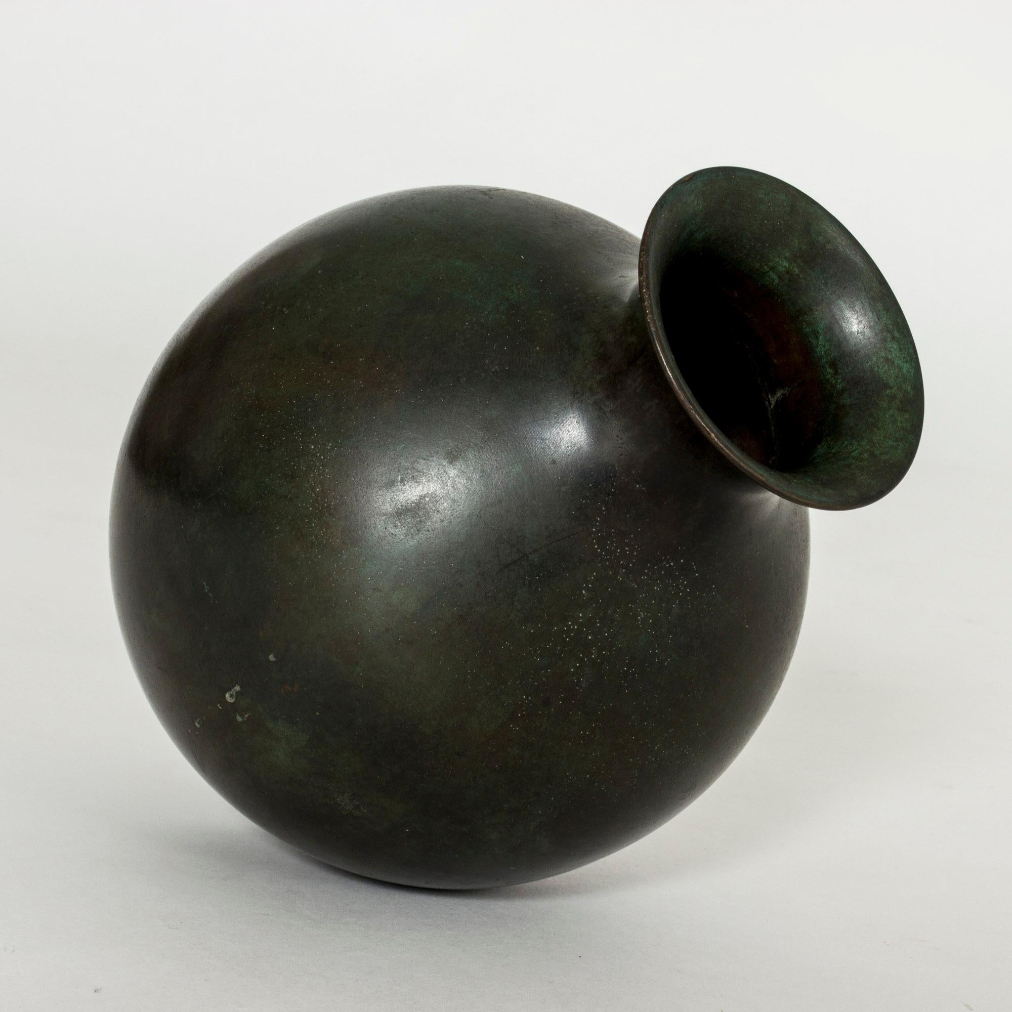 Elegant patinated bronze vase from GAB, in a smooth, plump design. Deep green, shifting color, heavy quality.