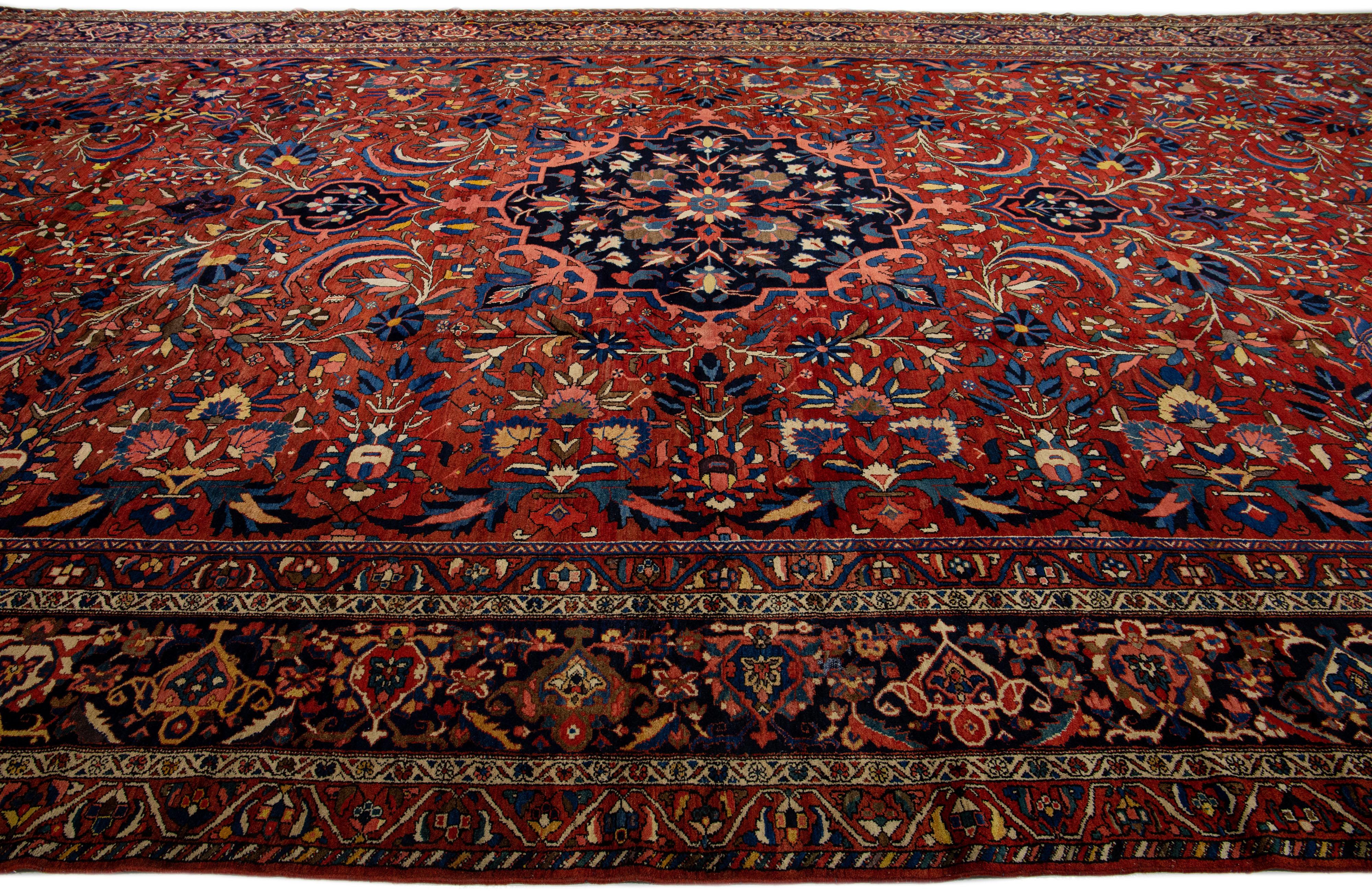 Hand-Knotted 1930s Persian Bakhtiari Handmade Wool Rug Rosette Motif in Red For Sale