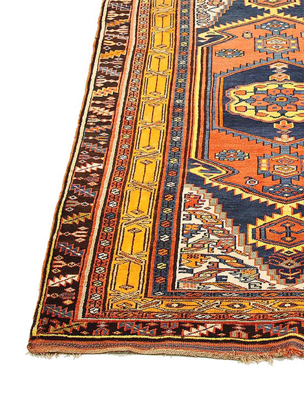 Antique Persian runner rug handwoven from the finest sheep’s wool and colored with all-natural vegetable dyes that are safe for humans and pets. It’s a traditional Bijar design featuring all-over rows of floral and geometric medallion details that