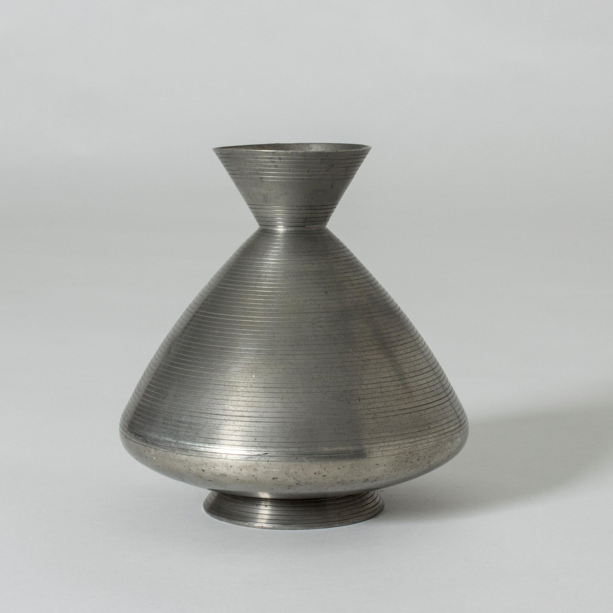 Pewter vase by Swedish Industrial designer Sylvia Stave, for C.G. Hallbergs Guldsmeds AB, later GAB, where Stave was creative director from 1931-1939. Minimalistic design with great proportions and subtle pattern of lines.