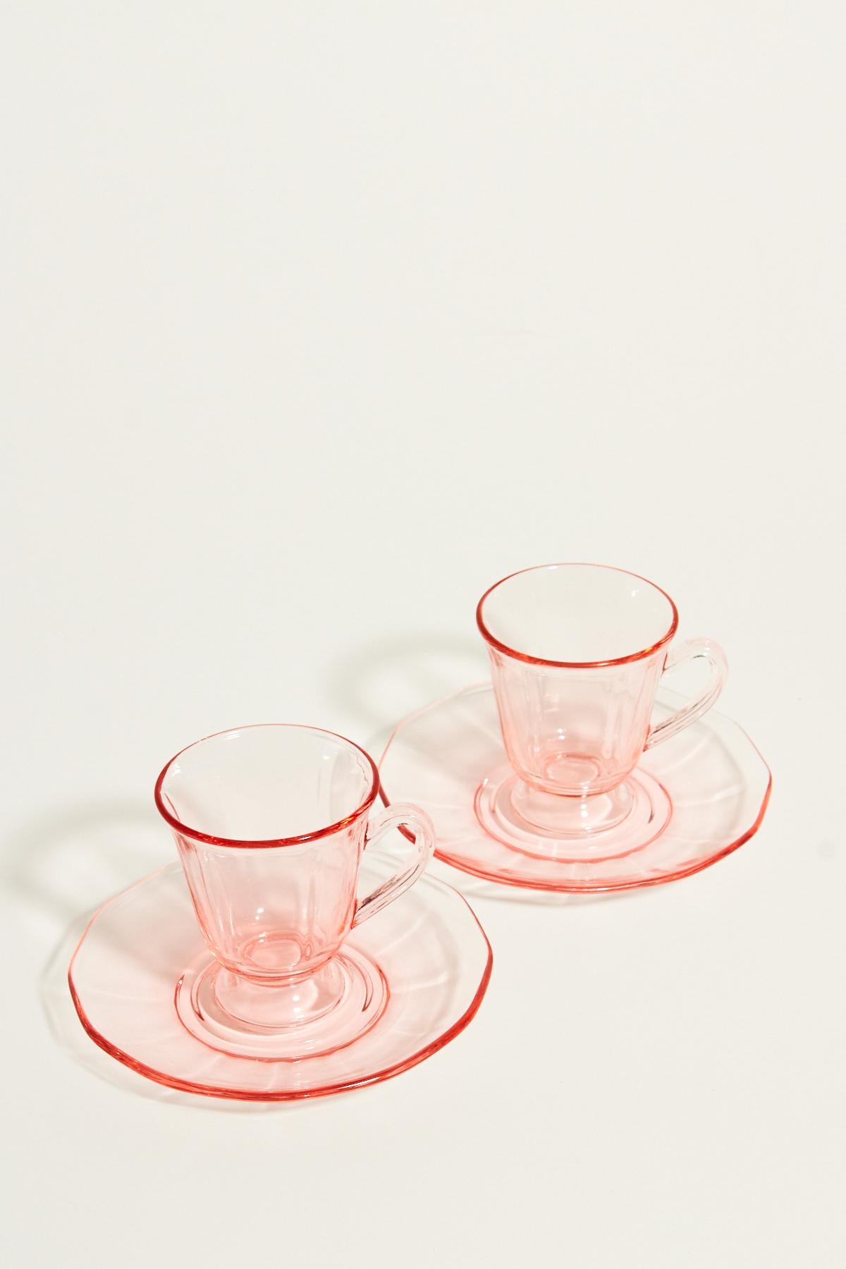 Sweet demitasse set of two in fluted pink glass with pedestal cups.
