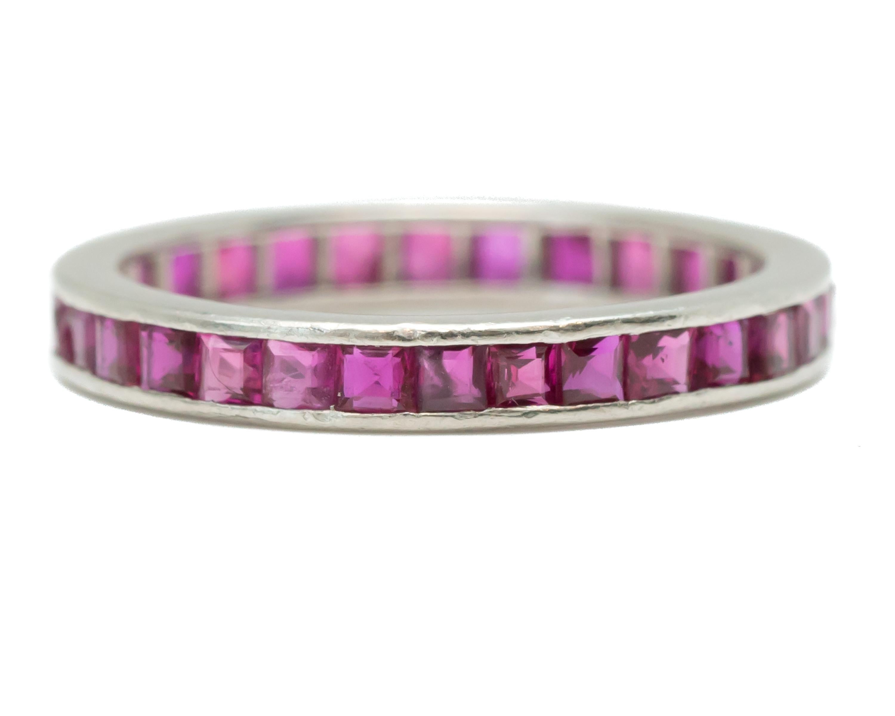 1930s Art Deco Ruby Eternity Band - Platinum, Rubies

Features:
French cut Square Rubies
Channel Set Rubies
Pinkish Red Rubies
Platinum Setting
Eternity Band Design
2.7 millimeters wide band
2 millimeters finger to top of ring
Ring fits a size 5.75,