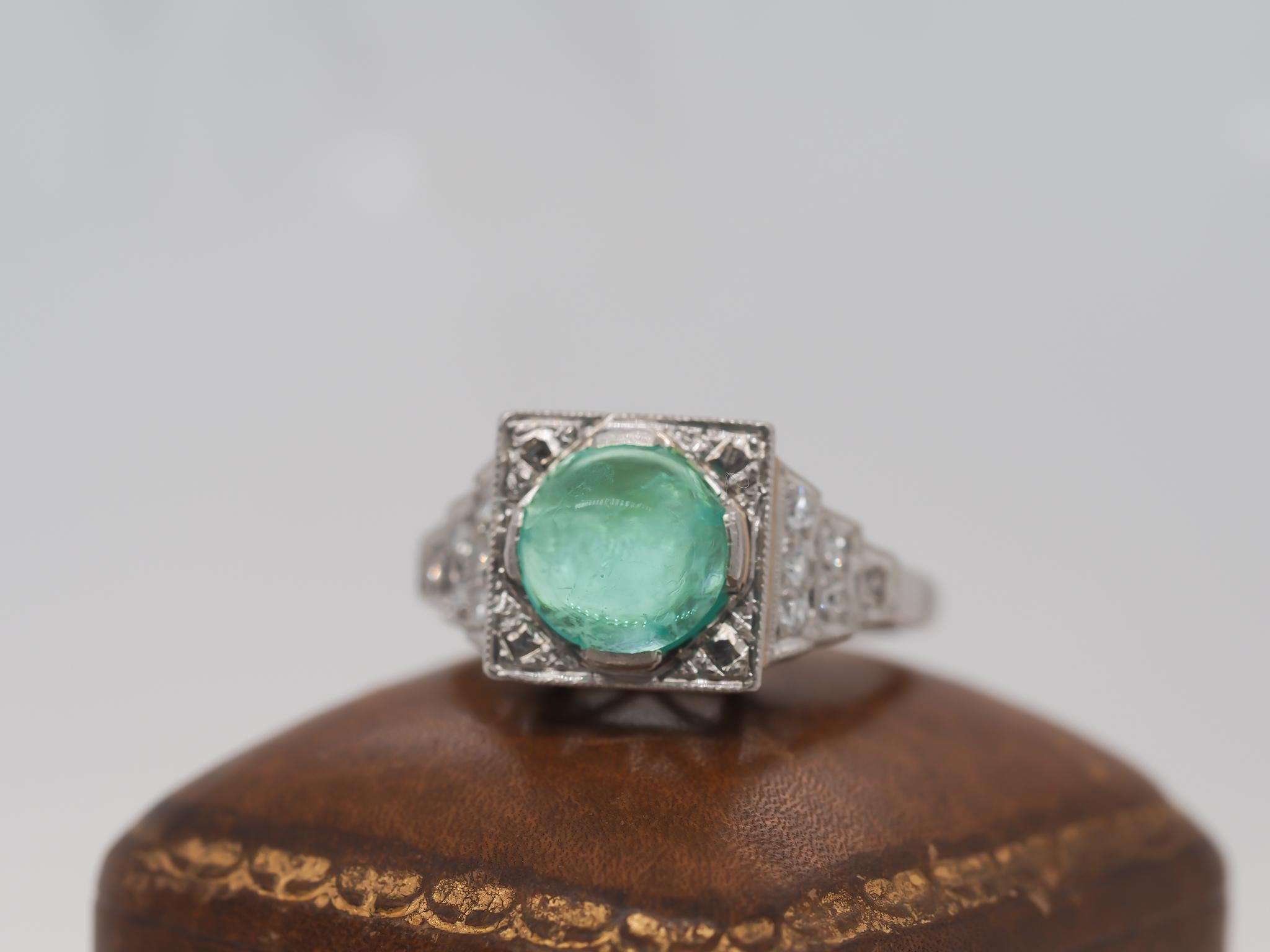 Year: 1930s
Item Details:
Ring Size: 7 (Sizable)
Metal Type: Platinum [Hallmarked, and Tested]
Weight: 6.95 grams
Diamond Details: .20ct total weight, antique cut diamonds, G Color, VS Clarity
Emerald Details: Natural Emerald, 1.75ct, Cabochon