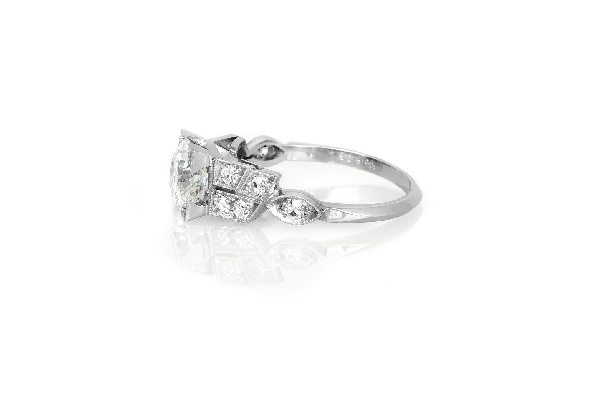 The beautiful engagement ring is finely crafted in platinum with center diamond weighing approximately 1.00 carat and around diamonds weighing approimately total of 1.00 carat.
Circa 1930