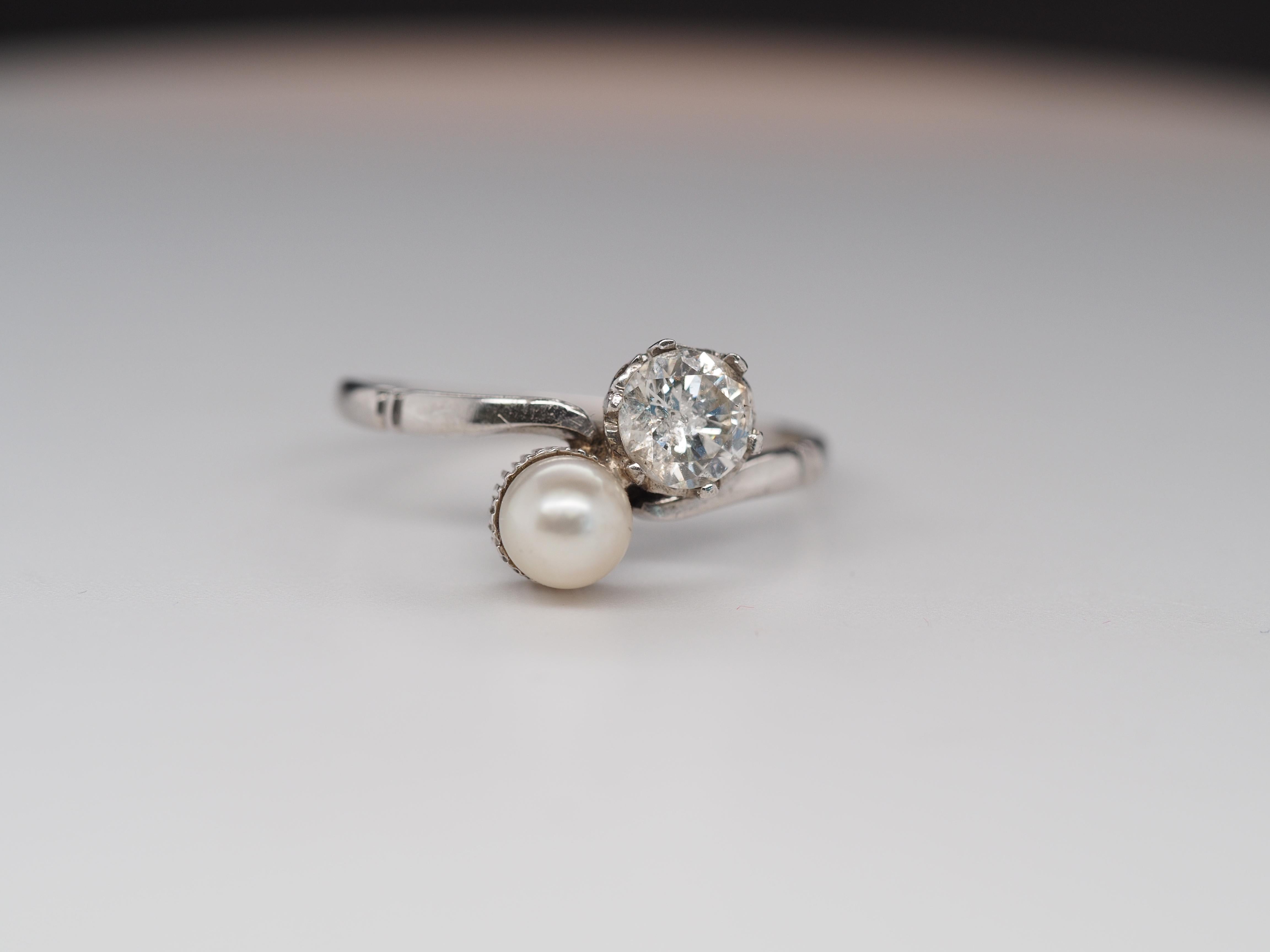 Item Details:
Ring Size: 7.5
Metal Type: Platinum [Hallmarked, and Tested]
Weight: 2.7 grams
Diamond Details: Transitional Round, .40CT, I2 imperfect, G Color
Pearl Details: natural, 4mm, ovals, pink/white hue
Band Width: 1.6mm
Condition: Excellent