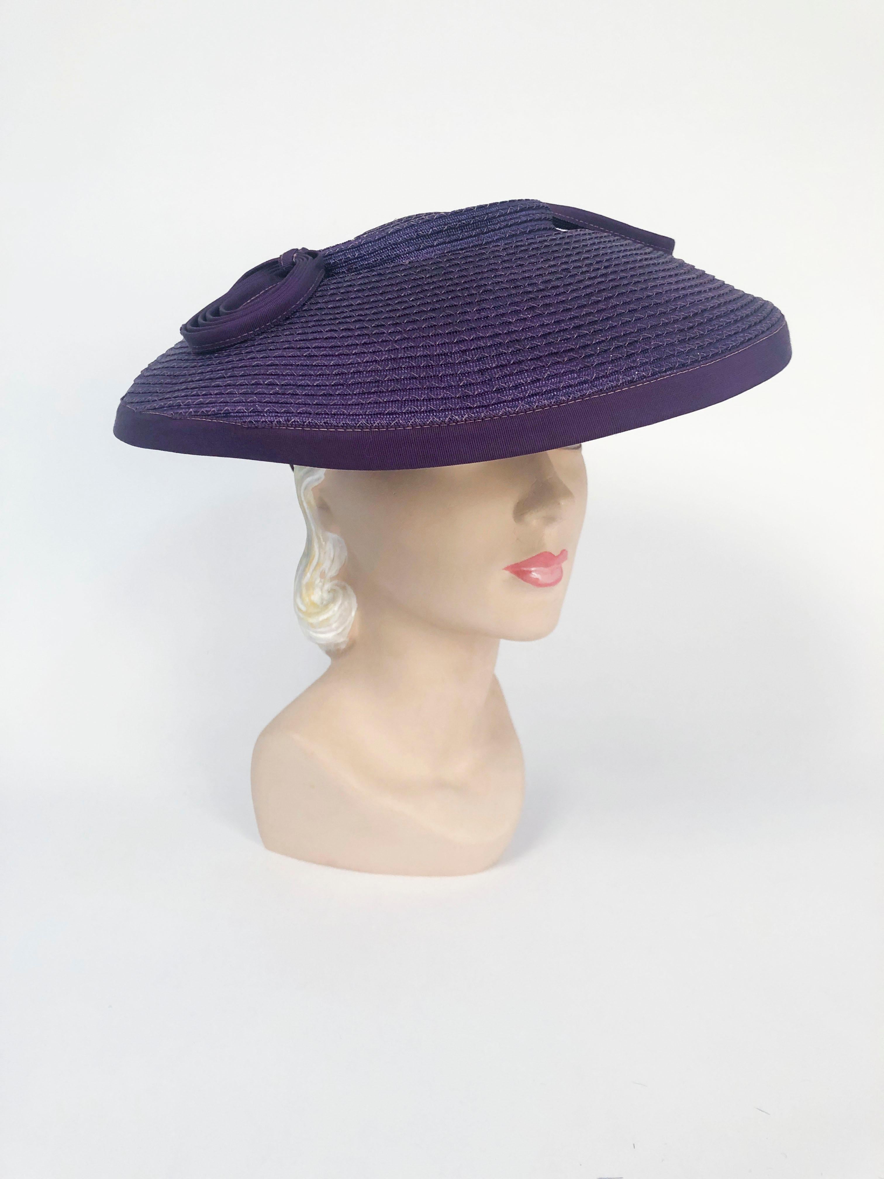 1930's Purple Coated Straw Hat with Loop Accents made of a matching gros-grain. This hat has a light contrast topstitch and a slant-strap to hold it in place. 