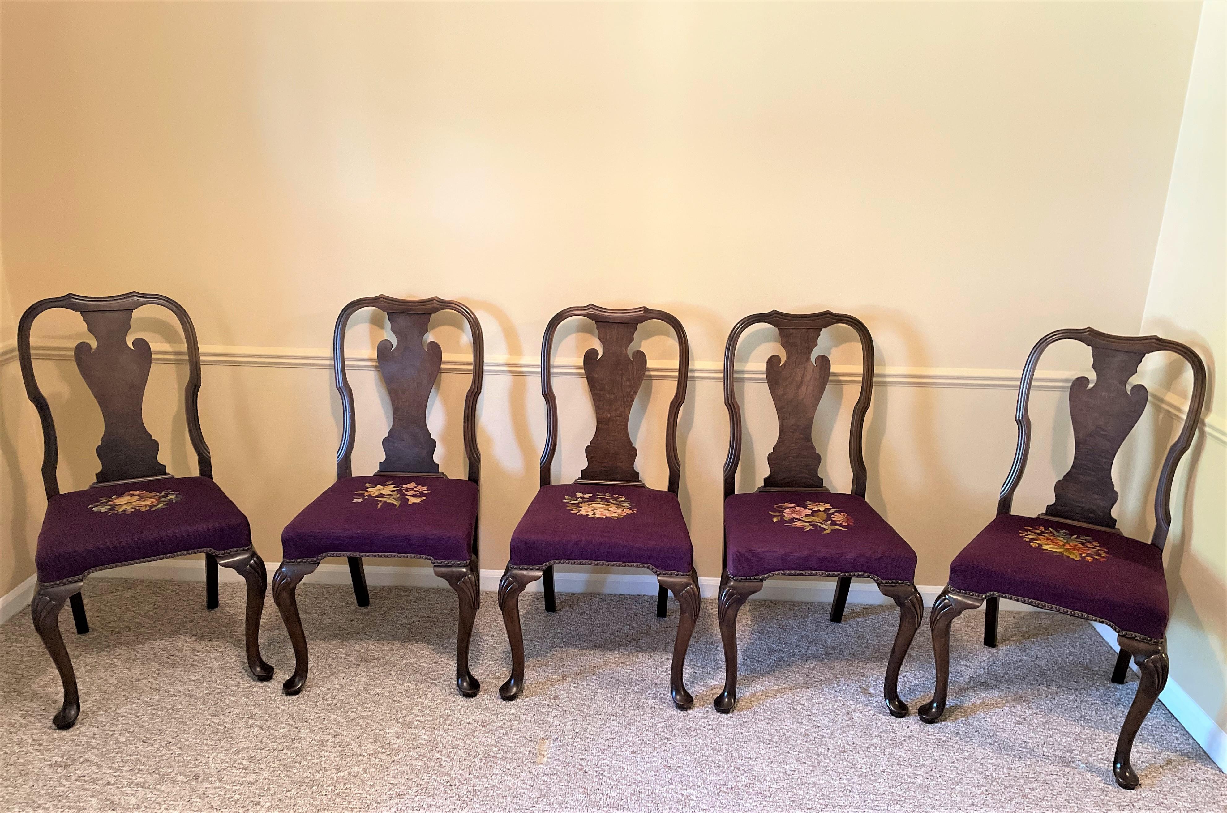 A spectacular set of solid walnut Queen Anne-style dining chairs from the 1930s in MINT condition -- and very well priced! Each chair is well-weighted with generous seat proportions and excellent build quality. 

Each seat cushion is hand-done