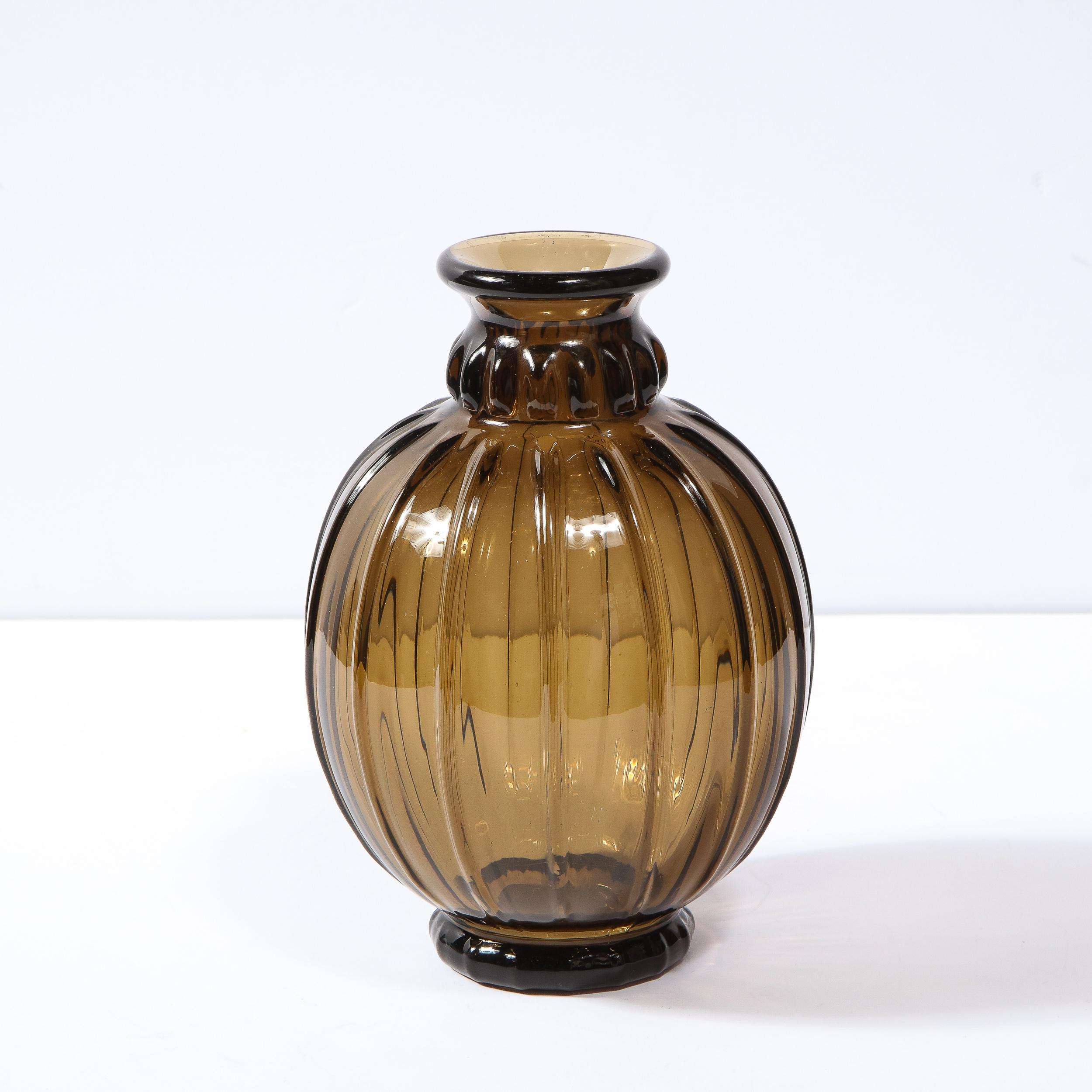 This elegant topaz and museum quality French Art Deco hand blown glass vase by the studio Daum is designed with vertically equidistant repeating bands tapered to a 2.5