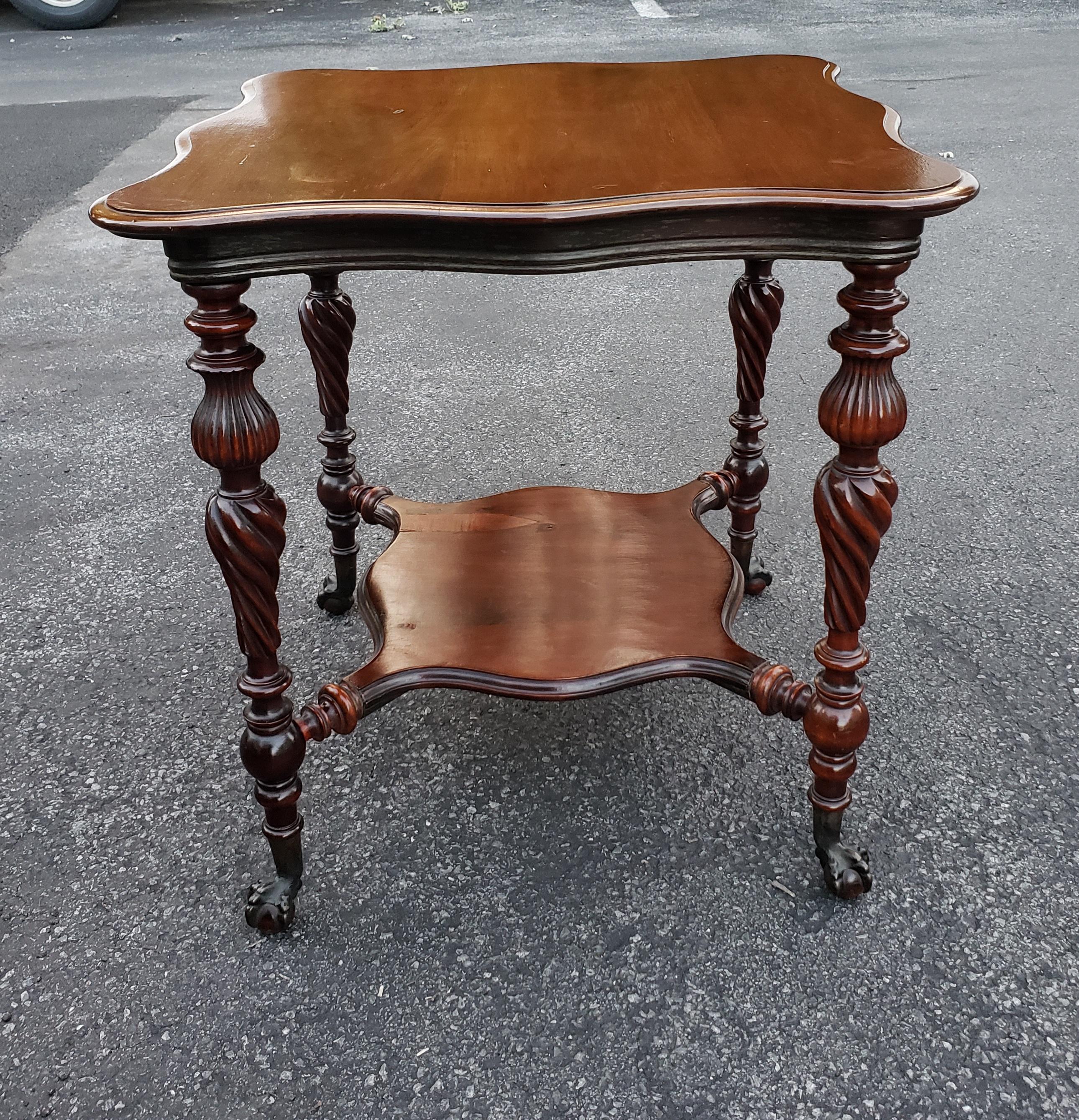 A 1930s Regency Style Mahogany Tiered Tea Table with Ball Claw Feet and a combination of bobbing, rope twisted and reedled legs. Measures 27