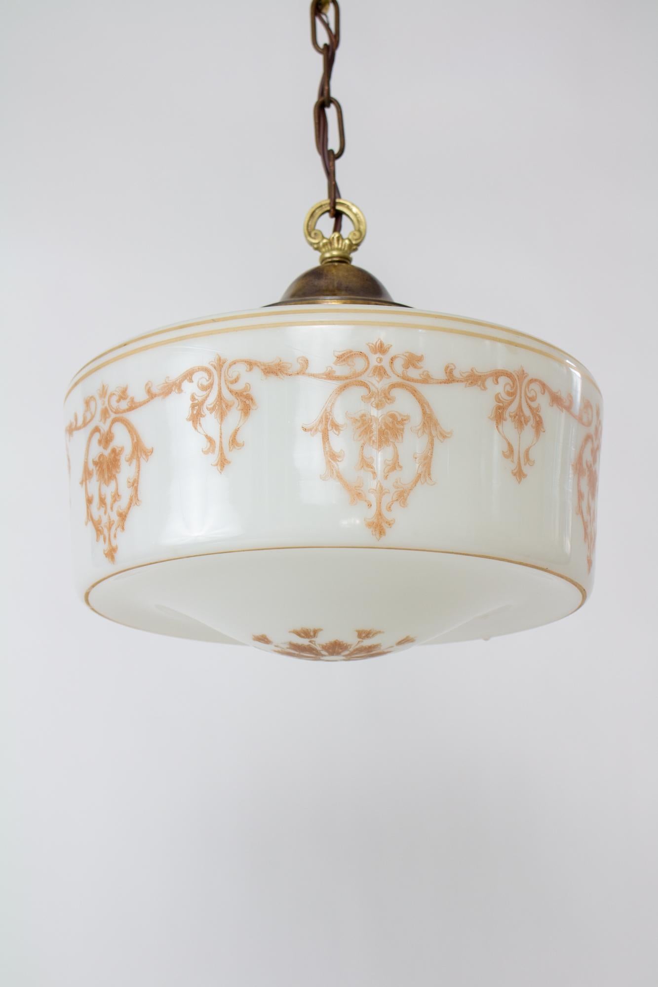 1930’s revival Monax glass applique pendant. Monax glass is often confused with milk glass, but is a translucent white glass with a slight bluish hue. It appears more delicate than milk glass. The glass pendant is in a classic shape of the art deco