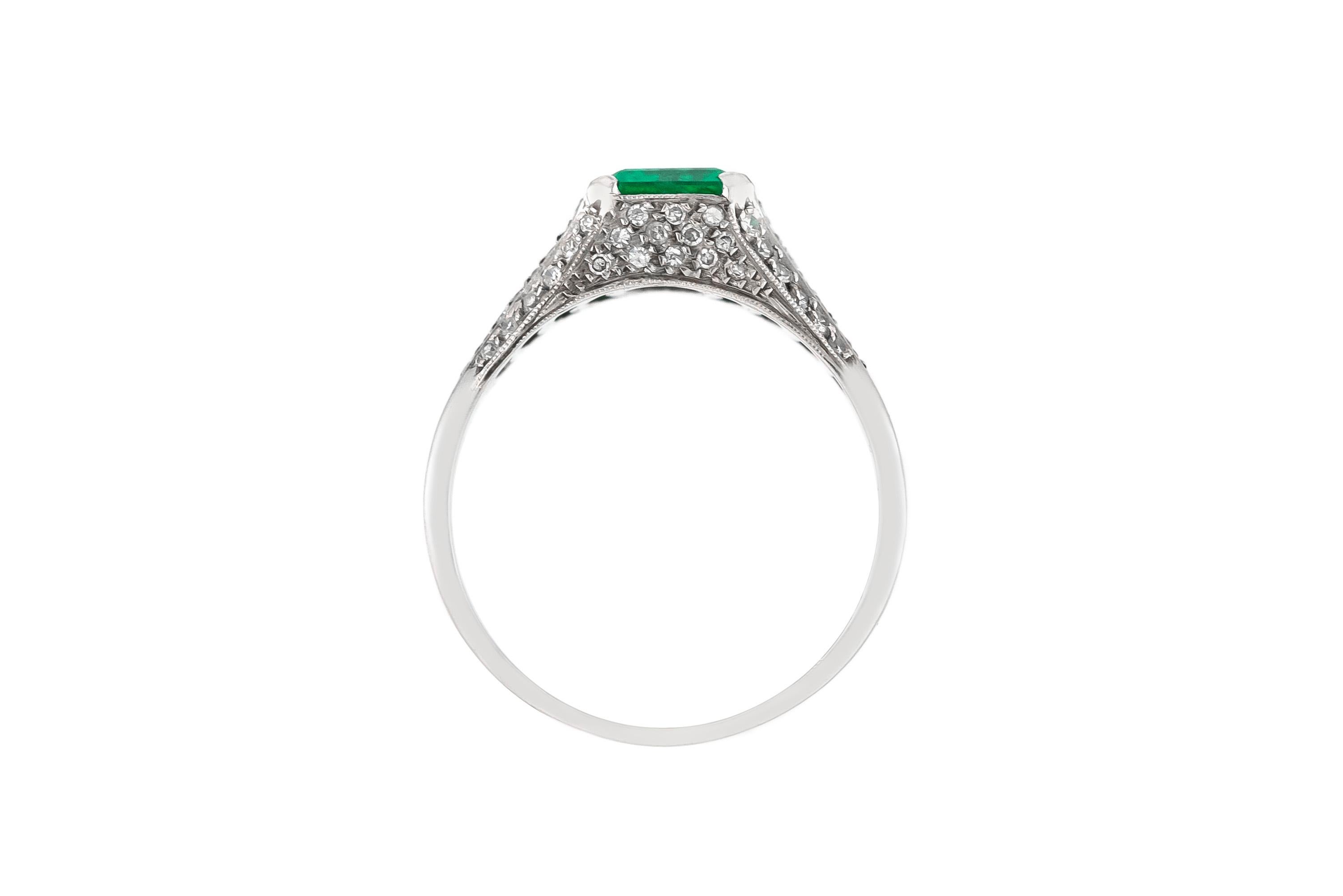 Round Cut 1930s Ring with Center Emerald and Round Diamonds on the Side Ring For Sale