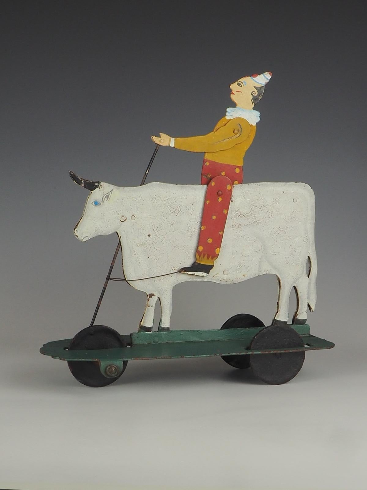 Metal 1930s Rodeo Clown on a Bull Pull Toy For Sale