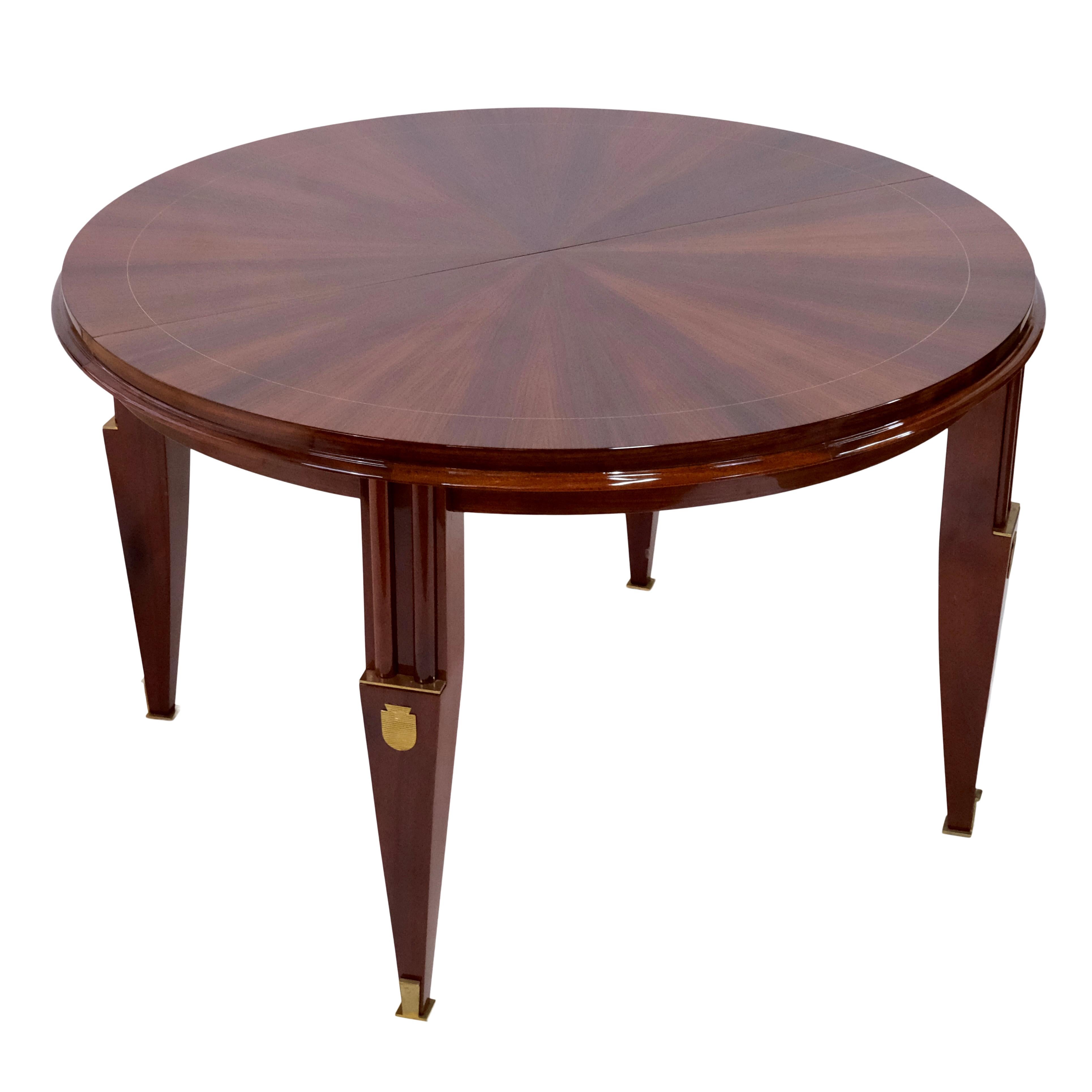 Round dining table with extension (2x 40cm) 
Mahogany, shellac hand polished 
Brass fittings

Original Art Deco, France 1930s

The table can also be used as a nice center table at your entrance. 

Dimensions:
Diameter: 124 cm 
Height: 76
