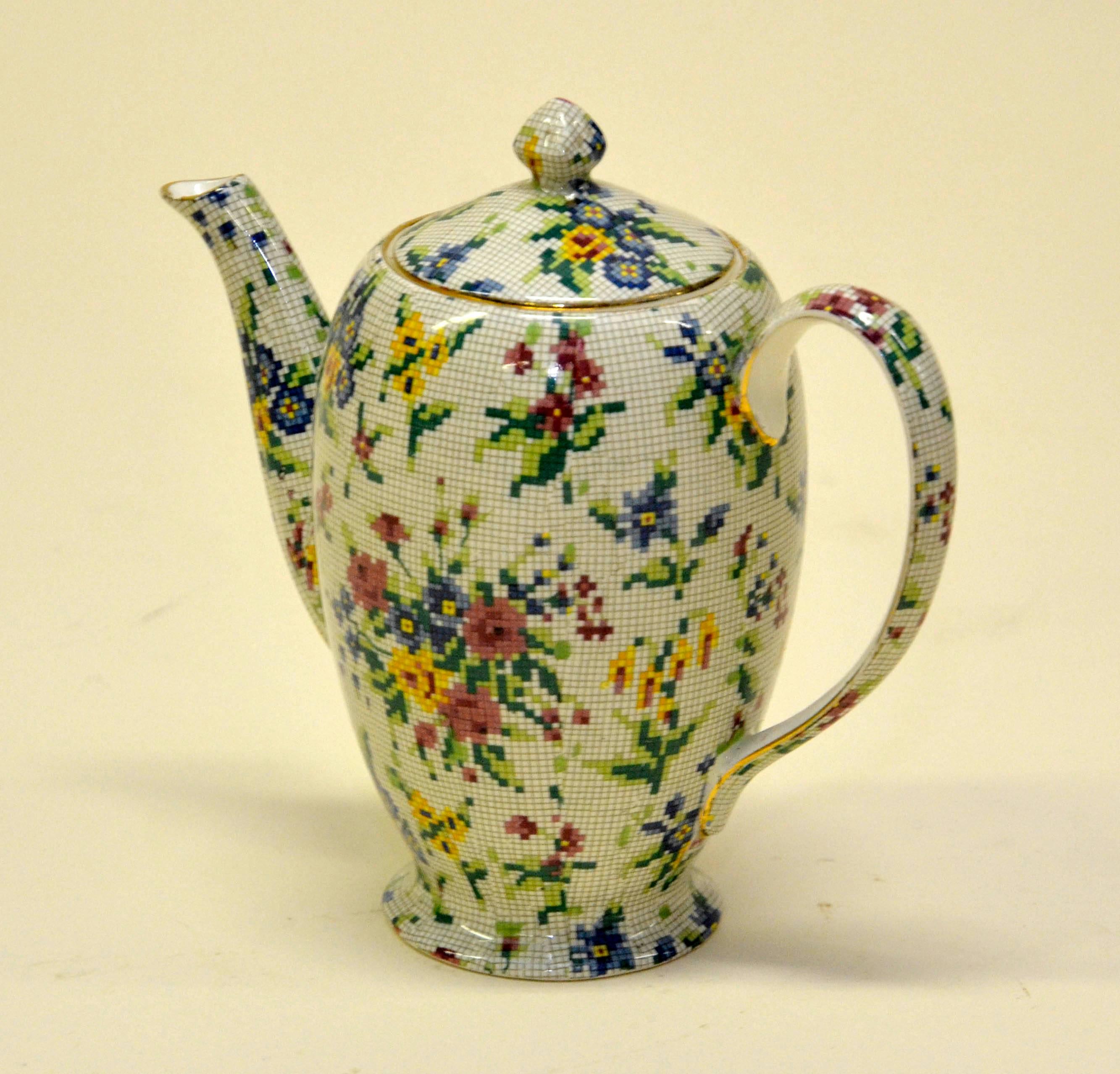 Rare Royal Winton earthenware coffee pot in pristine condition, not restored and ready to be used. The Queen Anne (1936) needlepoint pattern is part of the famed Chintz collection by Royal Winton. It consiste of bouquets of flowers in pink, blue and