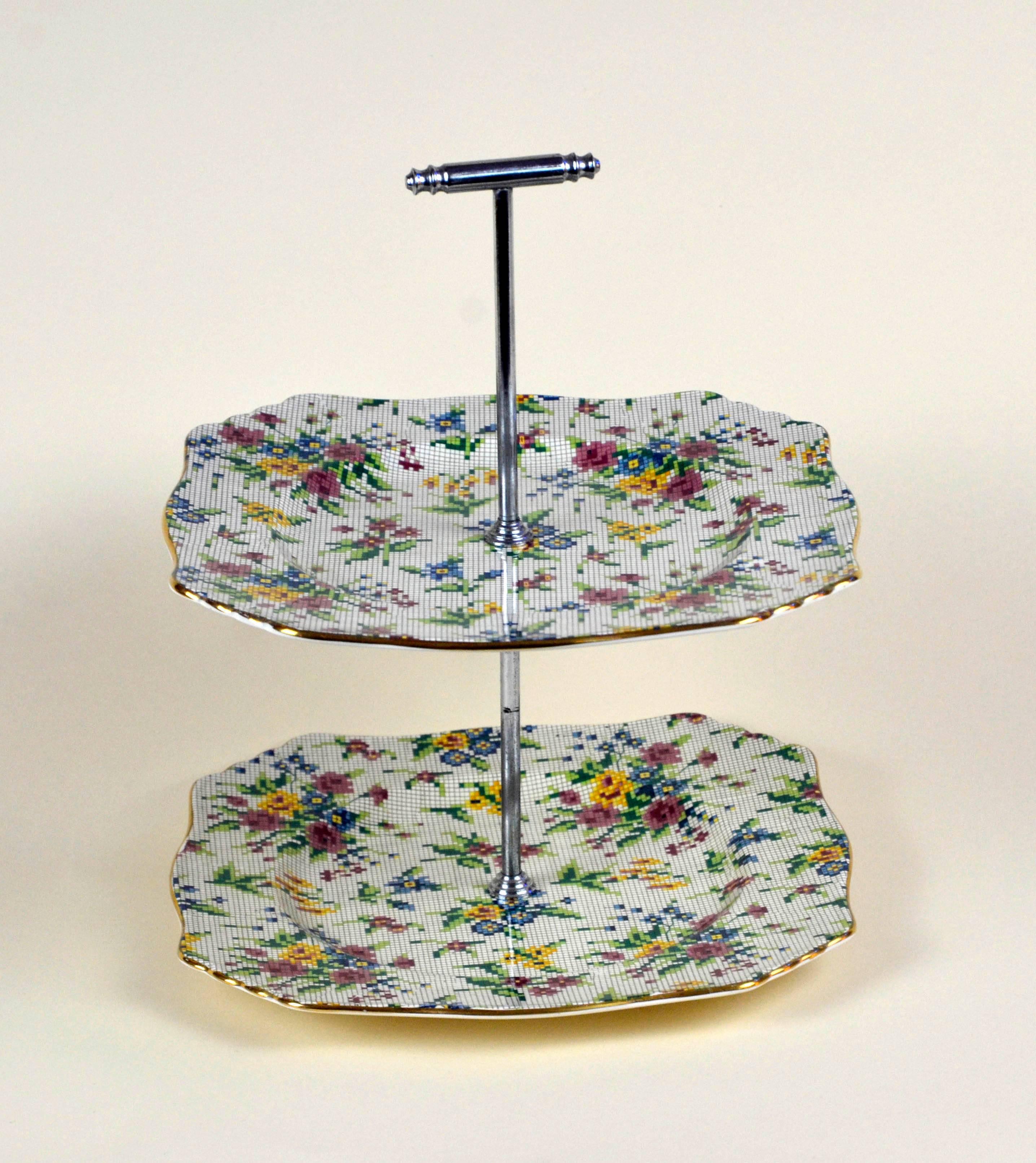 Royal Winton earthenware two-tier tidbit tray, cupcake Stand in pristine condition, not restored and ready to be used. The Queen Anne (1936) needlepoint pattern is part of the famed Chintz collection by Royal Winton. It consist of bouquets of