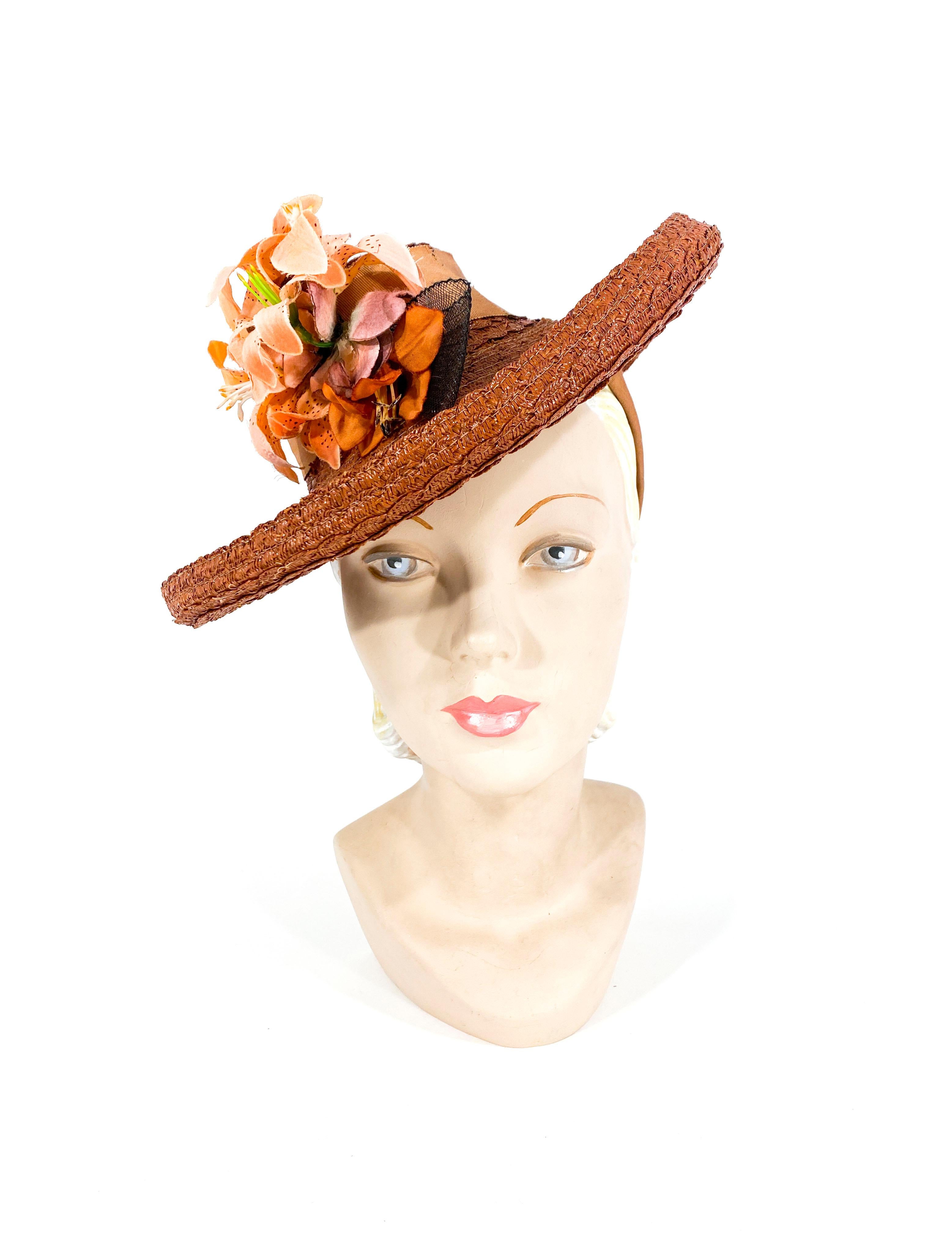 1930s rust colored coated straw hat made of rows of scalloped weaving along the crown and curled brim. The crown is styled like a toy hat with perch grosgrain bands that are worn on the back of the head. The top of the hat is also adorned with wide