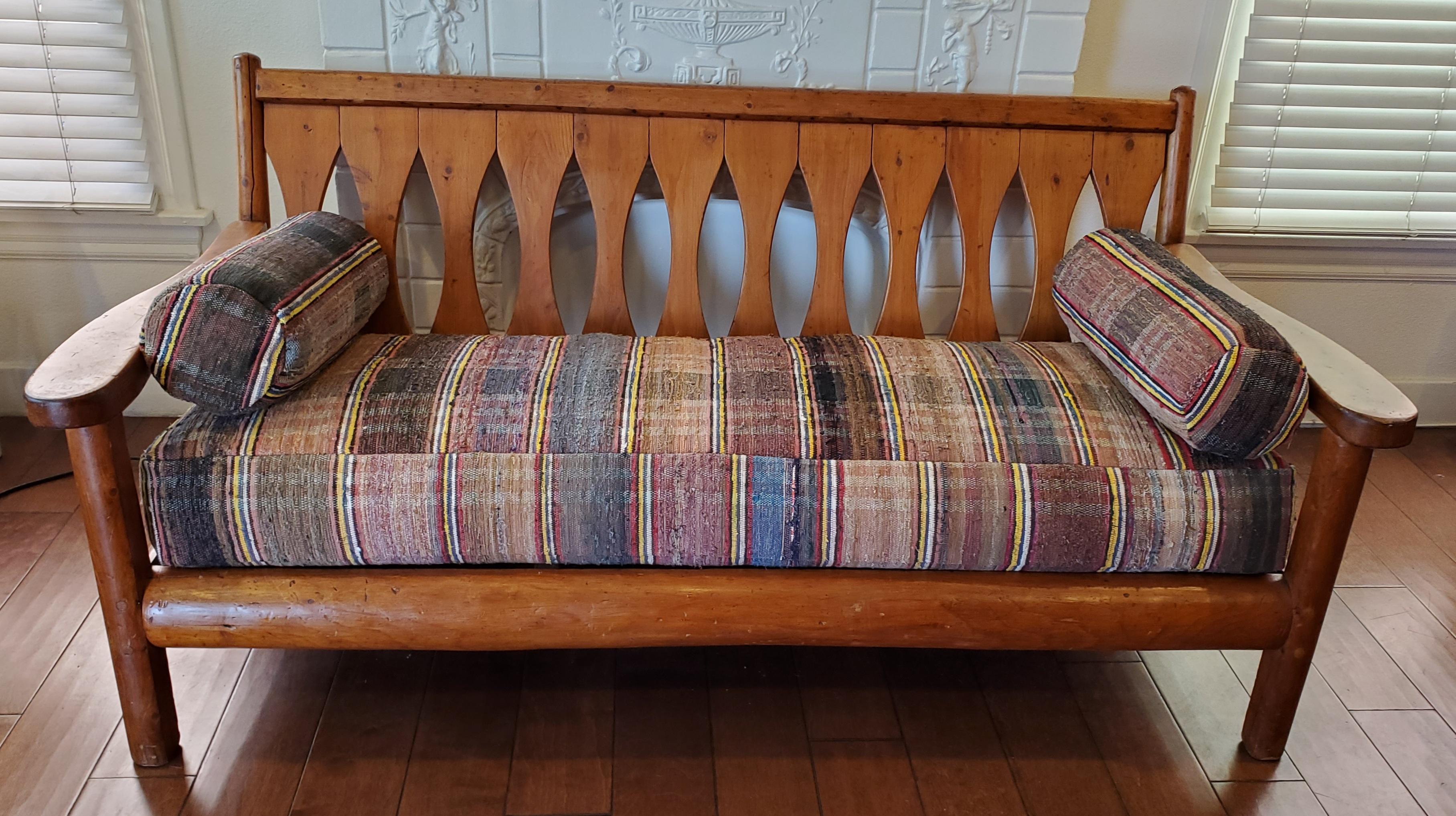 This amazing old Rittenhouse log hickory sofa from the mid west is in very sturdy condition. It was made in Michigan and is all wood peg construction. This type of furniture was found in cabins and ranches. The seats and pillow cushions are made