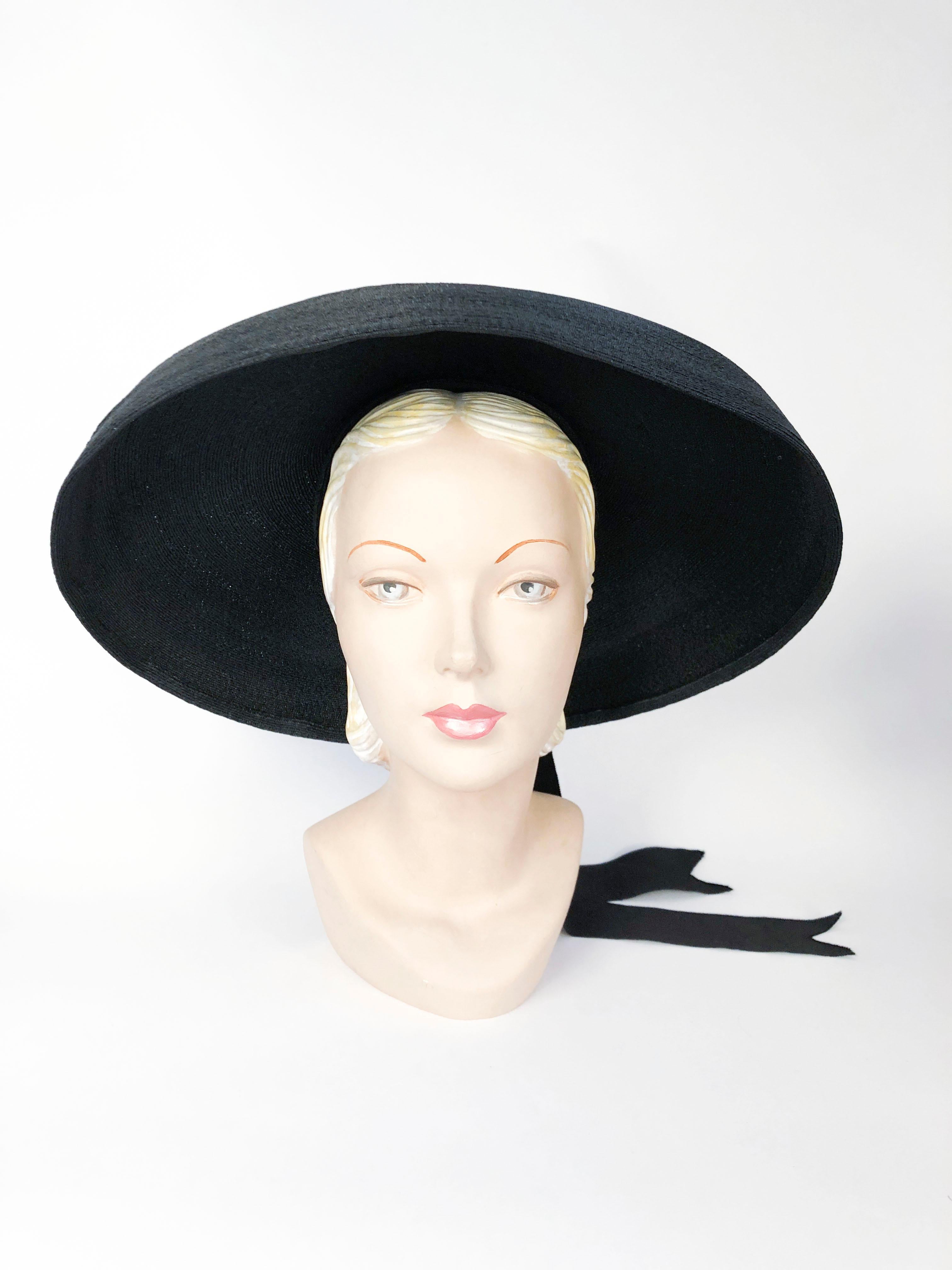 1930s/1940s Saks Fifth Ave. Black Straw Picture Hat with sculpted brim, layered crown, and a wide pleated band finished with an oversized bow.