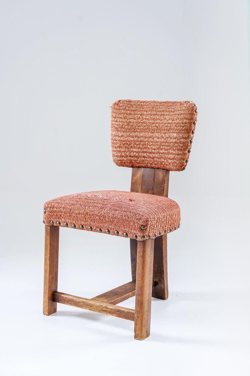 An expressive Scandinavian chair from the 1930s, remaining in the style of Axel Einar Hjorth. Constructed in solid wood with a robust, architectural frame, the piece reflects the rustic modernism associated with Hjorth’s Sportstugemöbler series,