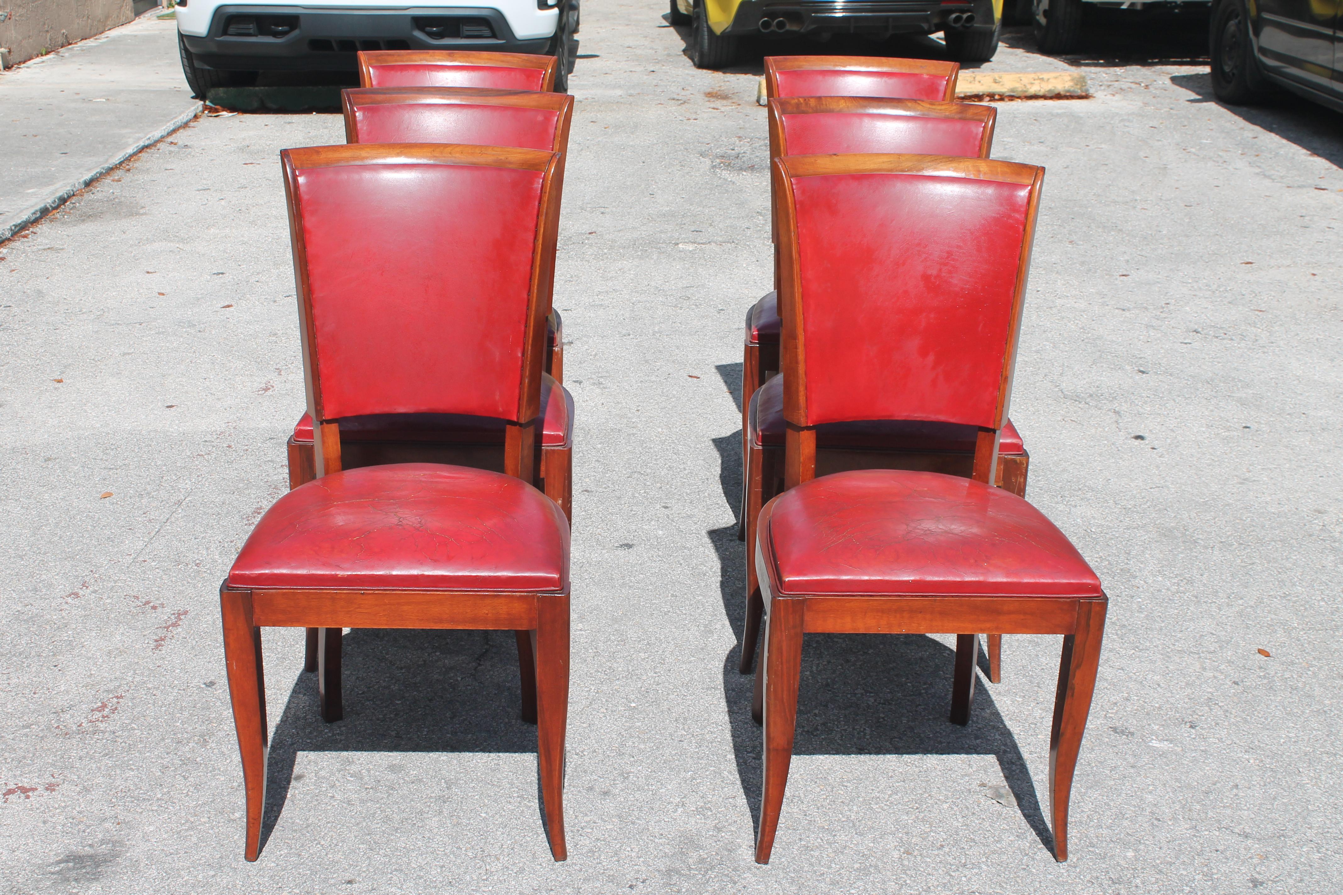 Set of 6 French Art Deco High Quality Dining Chairs in the style of Jules Leleu. Medium toned wood with beautiful flare leg. Estate. Sturdy frames and as with all of our Vintage/ Antique seating we recommend reupholstery. These chairs are in