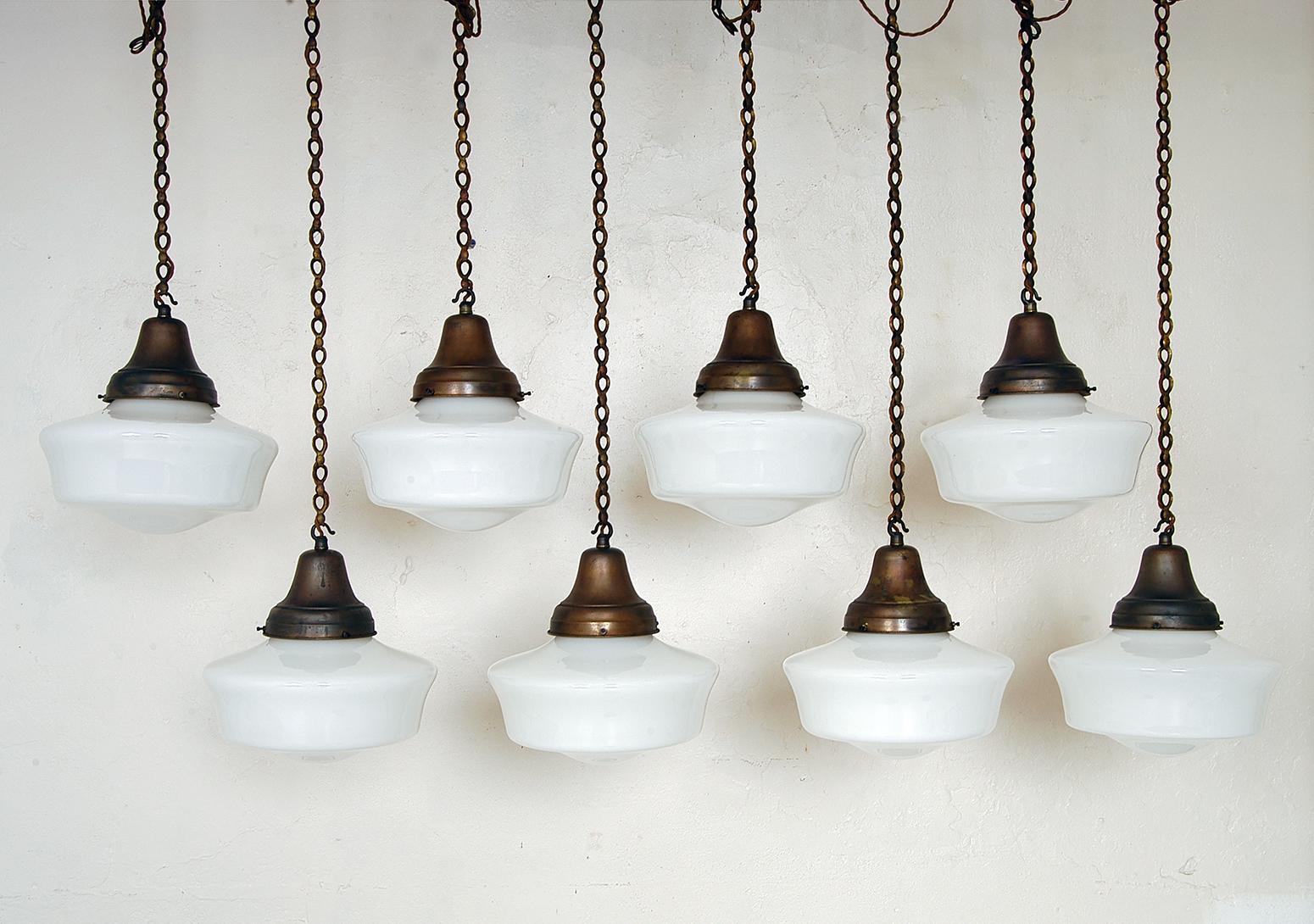 In original condition, this run of eight opaline glass Chapel lights date from the early 20th century, and have recently been reclaimed from a Chapel in Somerset, UK.
Wonderful original condition, with unpolished, well-patinated copper galleries,