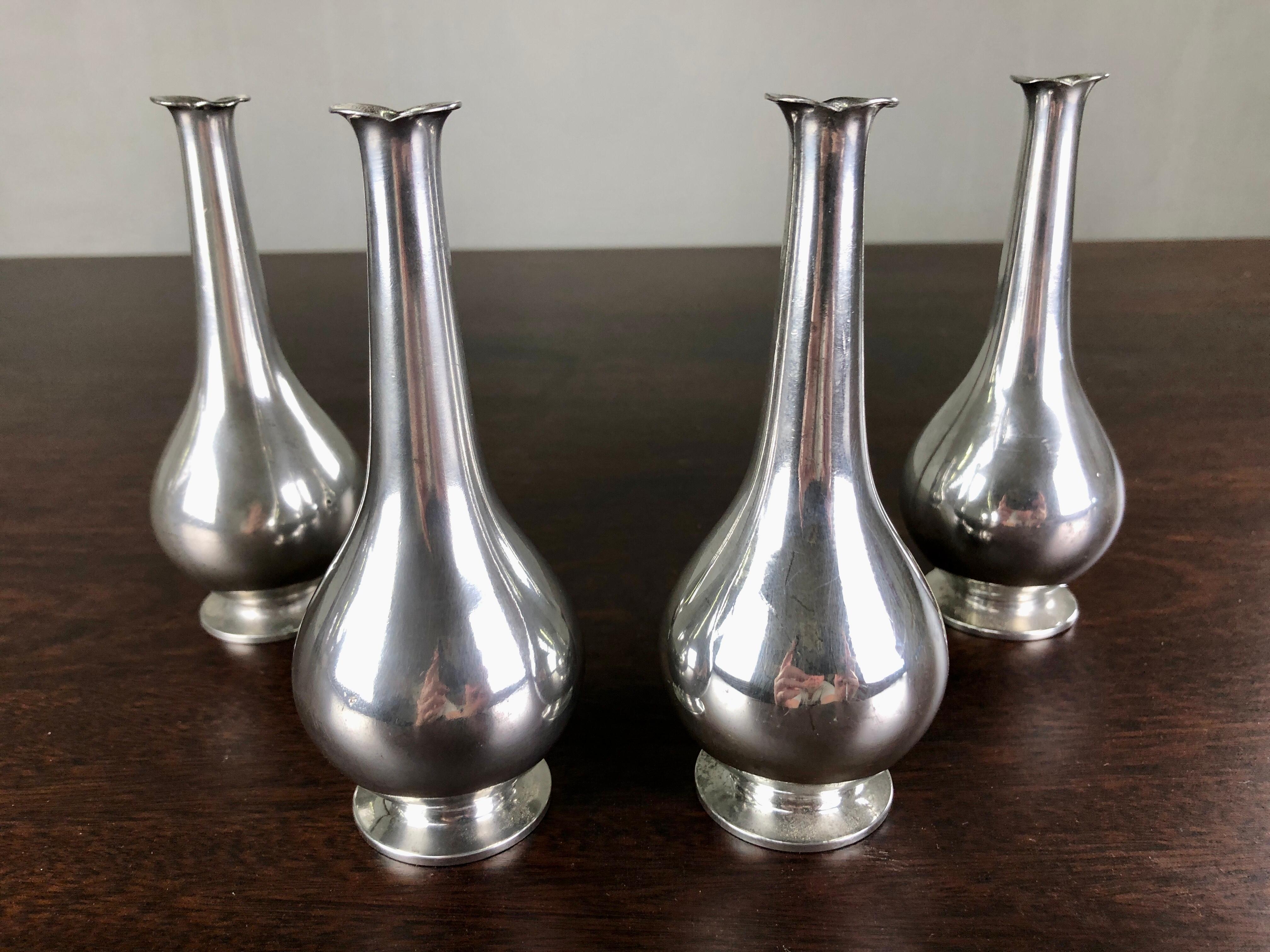 Set of four Danish Just Andersen art deco pewter vases produced by Just Andersen A/S in the 1930´s.

The vases with their simple yet demanding organic shapes are in very good vintage condition and all marked with Just. Andersens triangle mark.