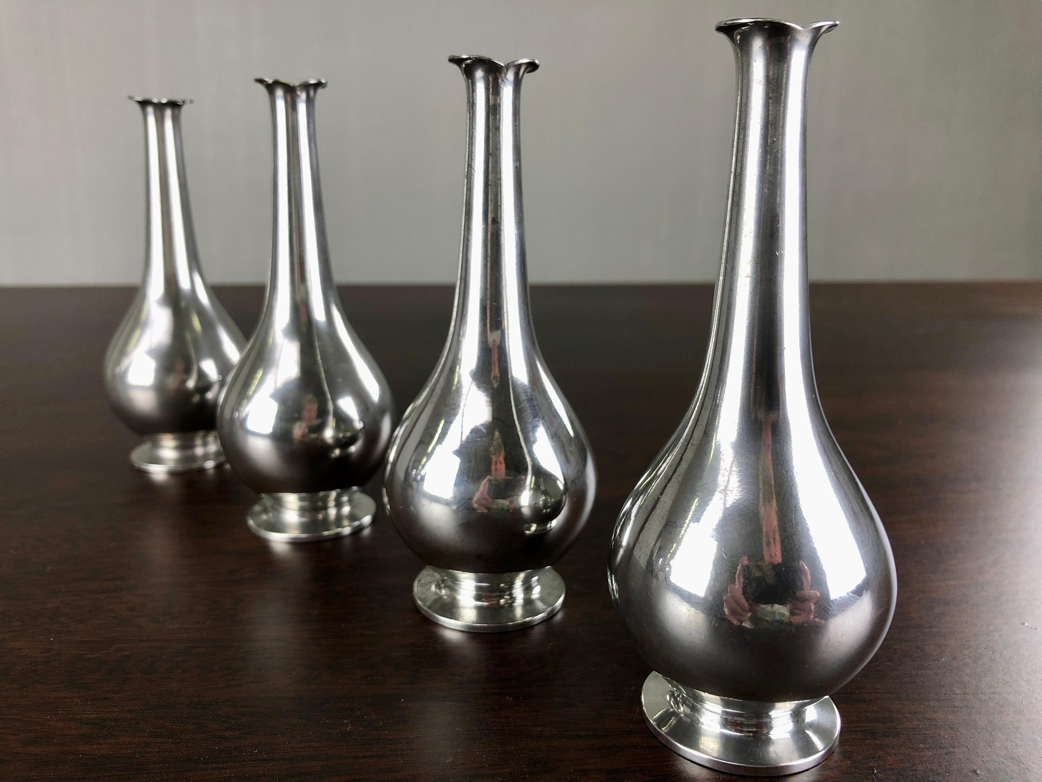 Set of four Danish Just Andersen art deco pewter vases produced by Just Andersen A/S in the 1930´s.

The vases with their simple yet demanding organic shapes are in very good vintage condition and all marked with Just. Andersens triangle mark.