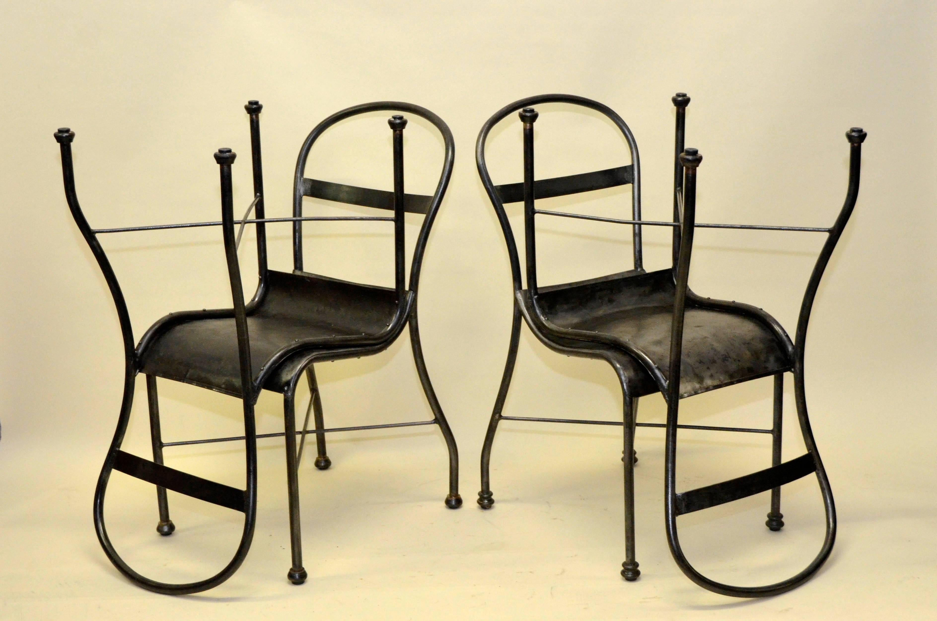 Set of four polished metal chairs from the 1930s. 

These chairs are fit for indoor display only.