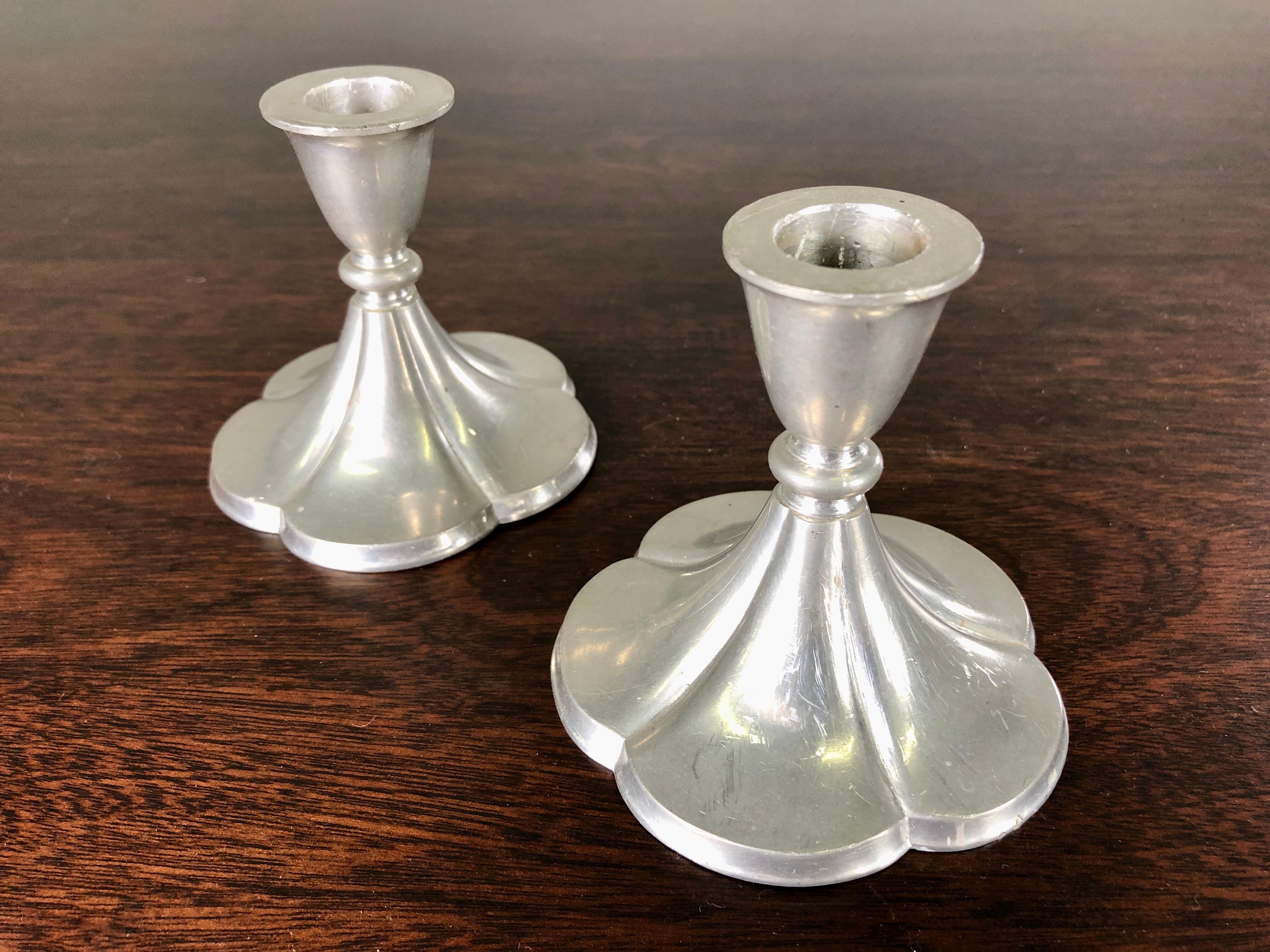 Set of two Danish Just Andersen art deco pewter andle holders produced by Just Andersen A/S in the 1930´s.

The candle holders are in good vintage condition and marked with Just. Andersens triangle mark. 

Just Andersen 1884-1943 was born in