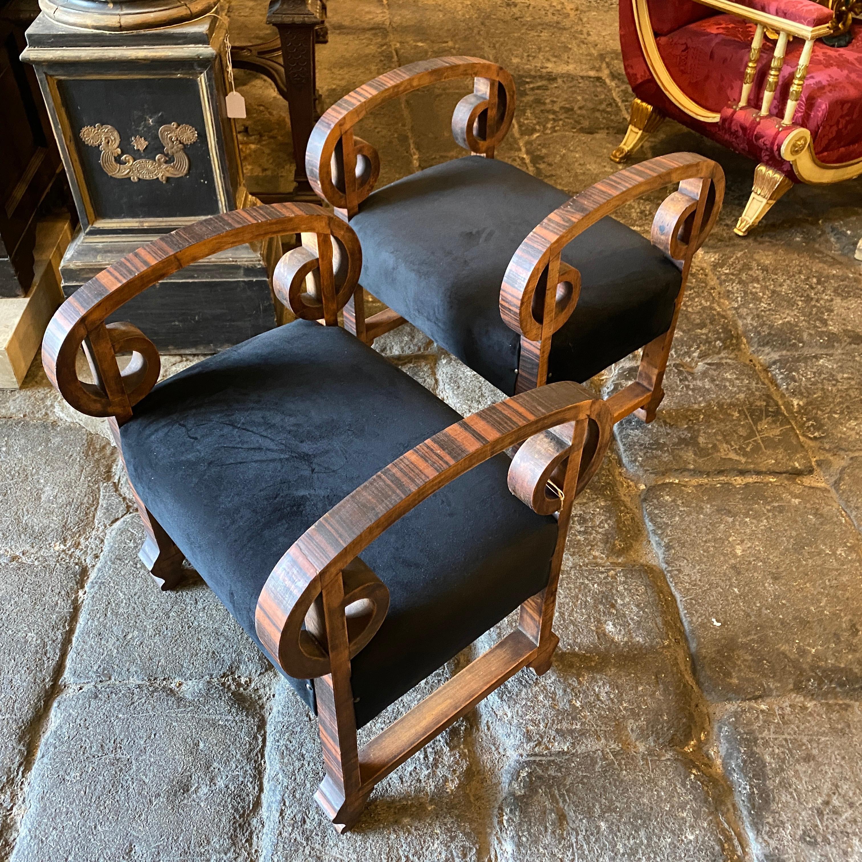 Two amazing wood poufs made in Italy in the 1930s, they have been upholstered in a gorgeous black velvet.
Wood it's in original conditions. They came from a Sicilian noble house.