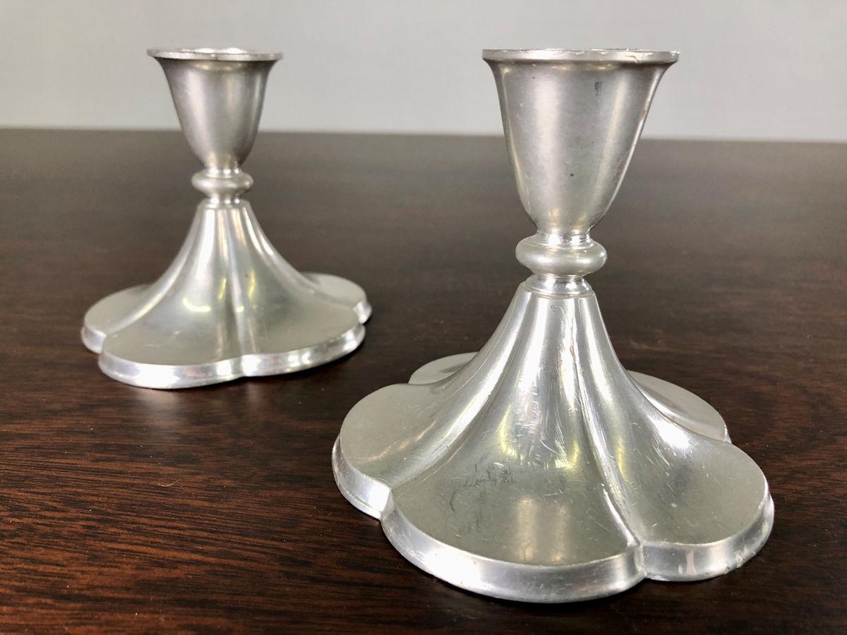 Set of two Danish Just Andersen five-leaf clover art deco pewter andle holders produced by Just Andersen A/S in the 1930´s.

The candle holders are in good vintage condition and marked with Just. Andersens triangle mark. 

Just Andersen 1884-1943