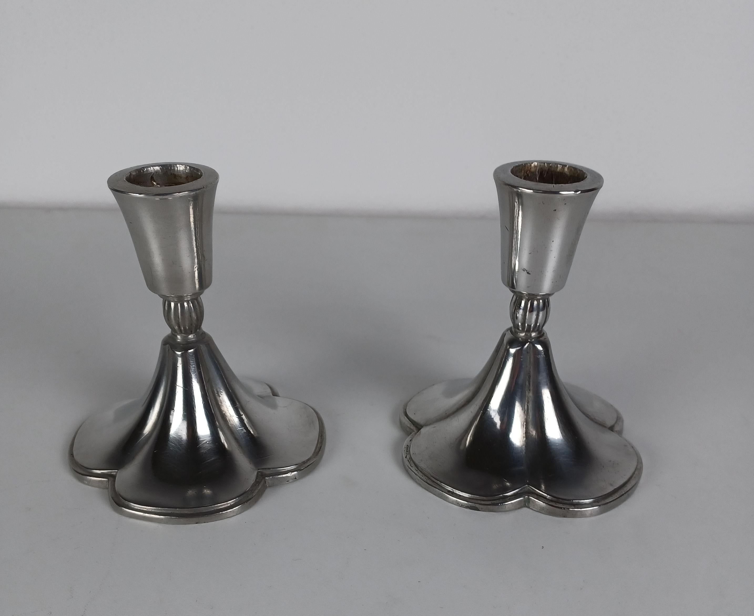 Set of two Danish Just Andersen four-leaf clover Art Deco pewter candle holders produced by Just Andersen A/S in the 1930s.

The four-leaf clover is a universally accepted symbol of good luck with its origin way back in time. It´s said that there