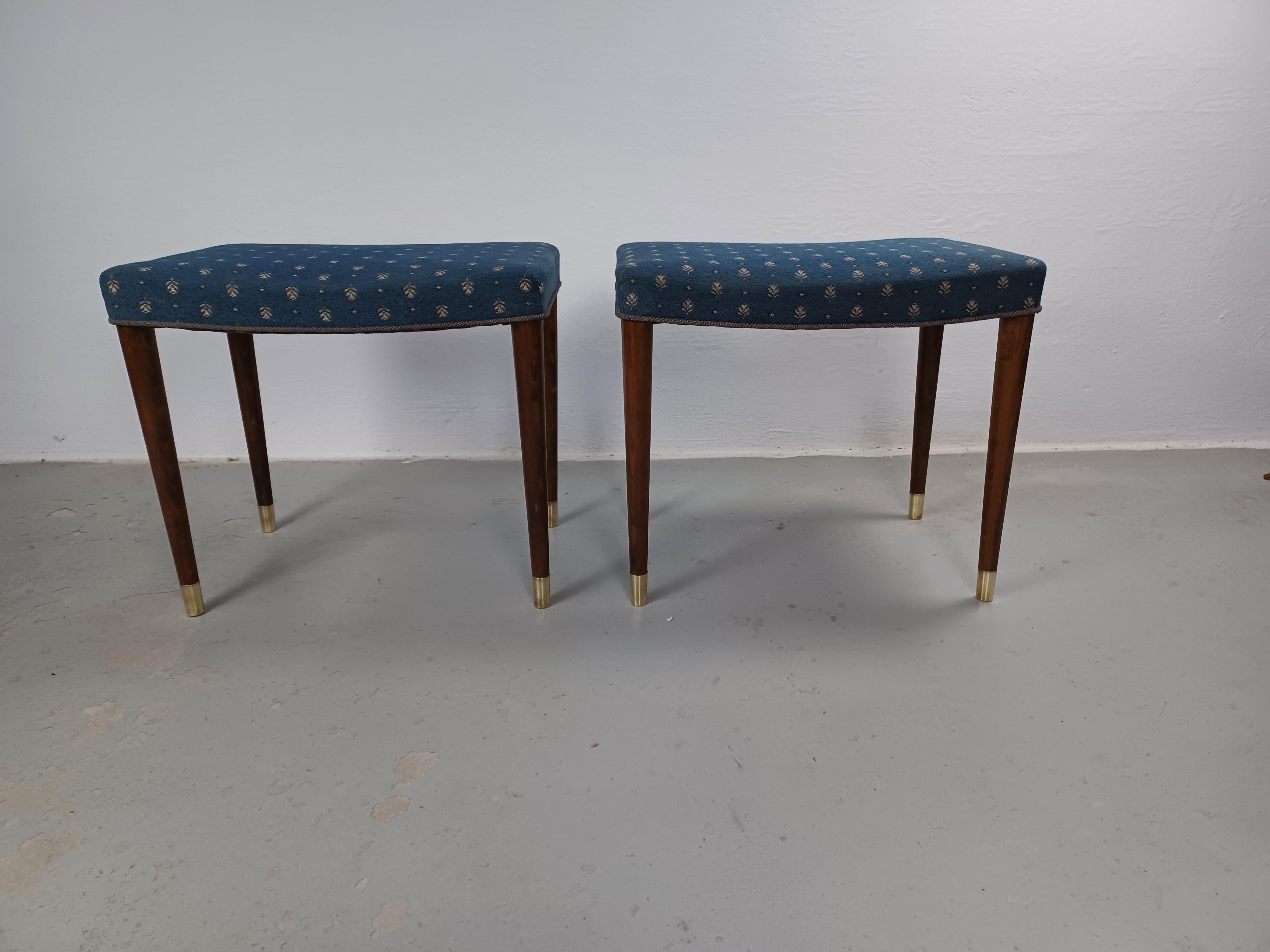 1930s Restored Danish Robert Rasmussen Art Deco Stools or Footstools 

Rare set of two Art Deco stools from the 1920s / 1930s with tanned beech legs, solid brass shoes and original upholstery in very good condirion on a well designed slightly curved