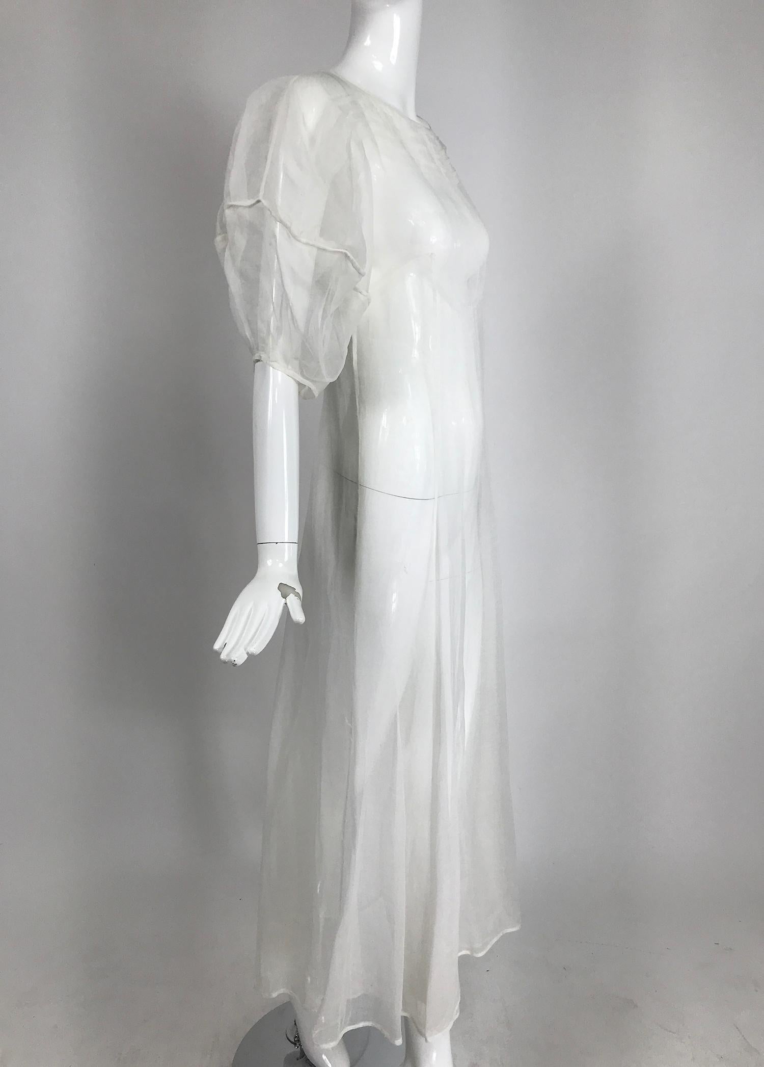     1930s Sheer white organza, lantern sleeve, gored skirt maxi dress, handmade. This beautiful dress is in amazing condition, from the 1930s it was handmade by an accomplished seamstress. It would make a lovely wedding dress. 
    The dress slips