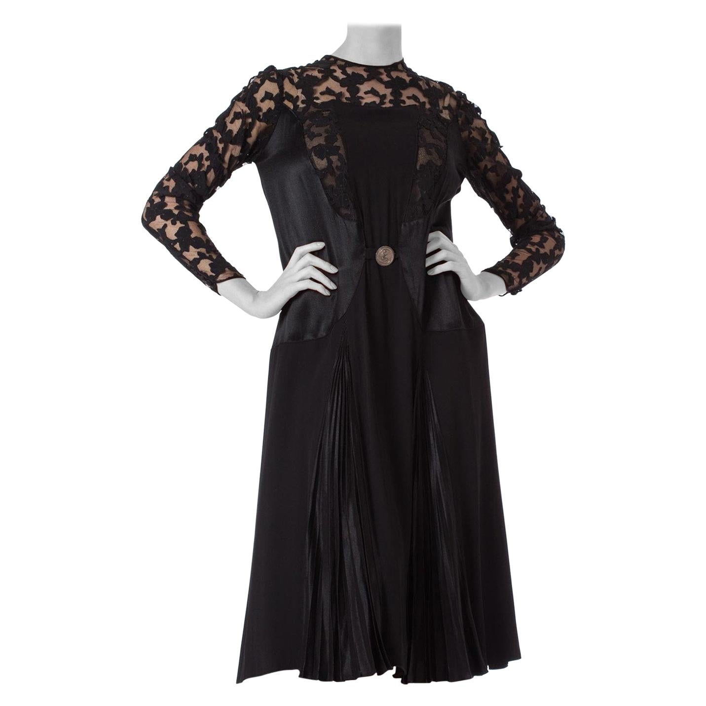 1920S Black Silk Crepe & Appliquéd Net Dress With Gorgeous Buckle Sleeves For Sale