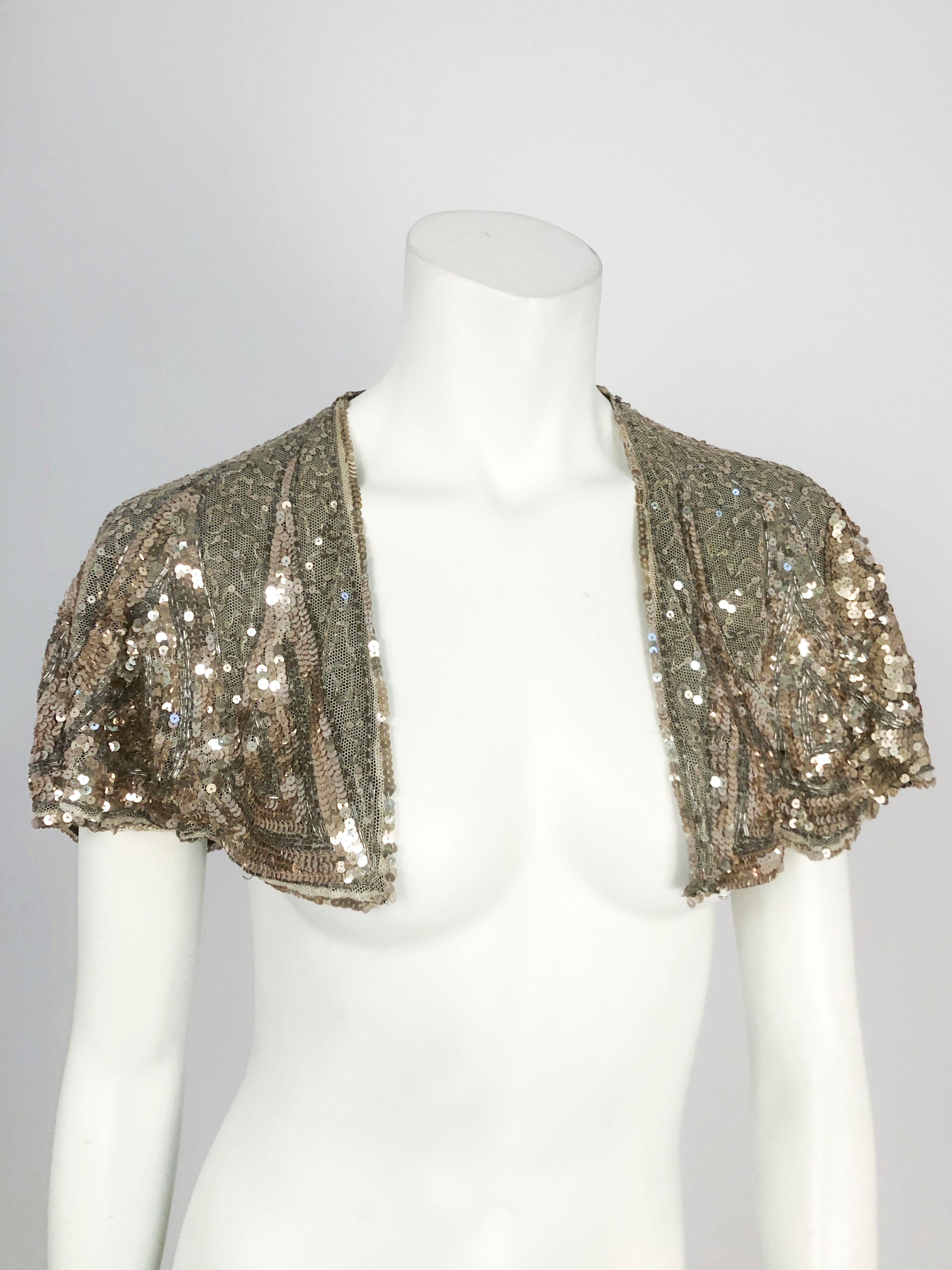 1930s Silver Sequin Capelet. Heavily sequined on a silk tulle, and lined in silk georgette.  