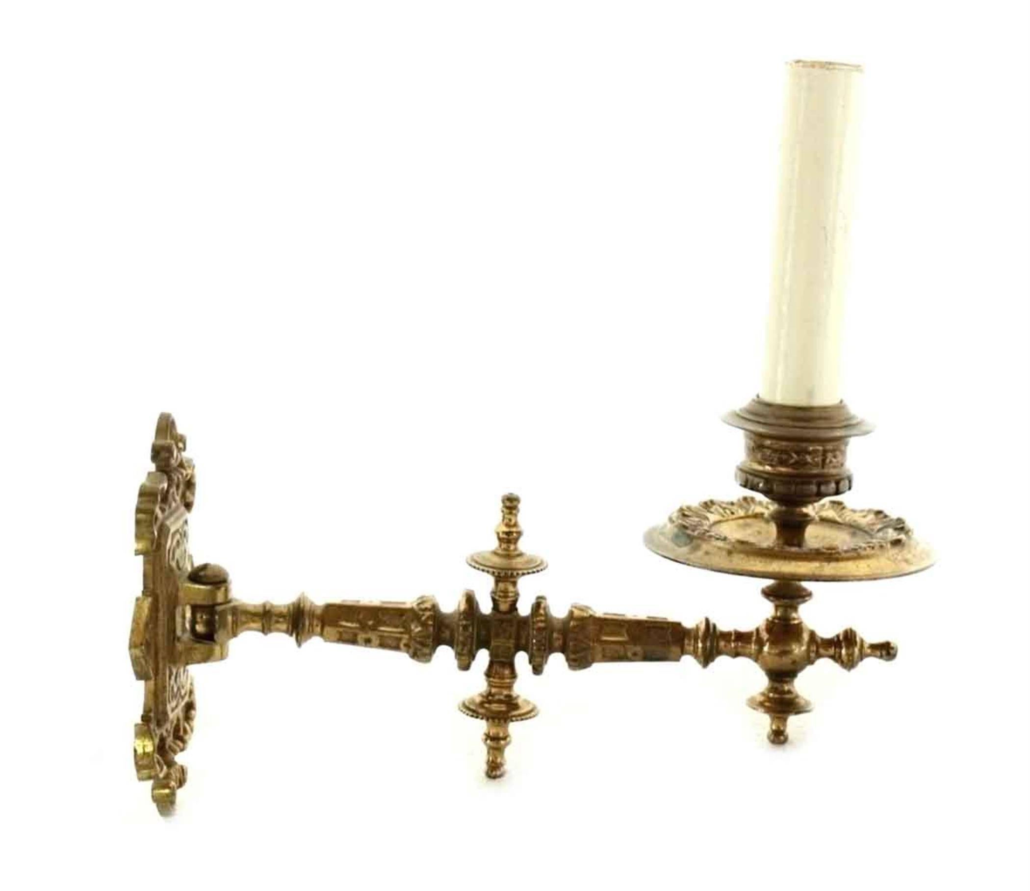 This is a 1930s single arm candle piano sconce with ornate detail in cast bronze. Priced as is. To have this sconce rewired and cleaned it will be an additional $50. This can be seen at our 400 Gilligan St location in Scranton, PA.