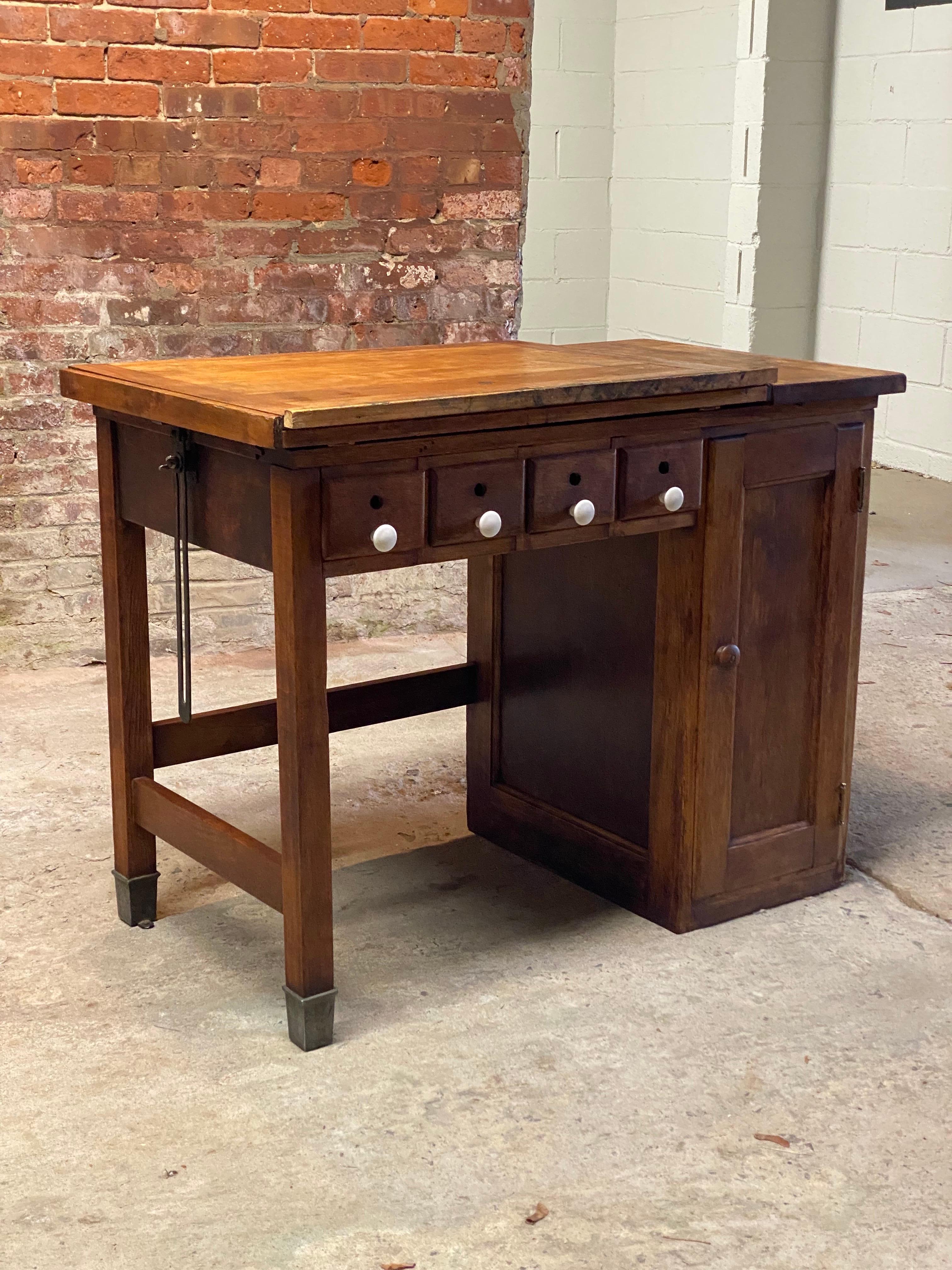 A wonderful small scale drafting table. The work table comes straight from the studio of popular Upstate New York watercolorist, Jim Adair and his estate. Jim Adair retired from a career in advertising and moved to the country in 1984 where he