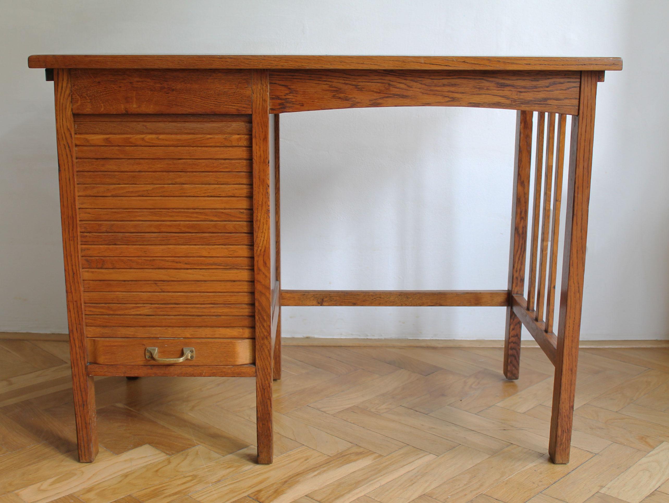This is an original solid oak child’s desk from the 1930’s. It was designed by the Jerry Furniture Company in America and was sold by Karel Vagner Furniture store in Brno (who gained exclusive licence for the Jerry desks and tables) in former