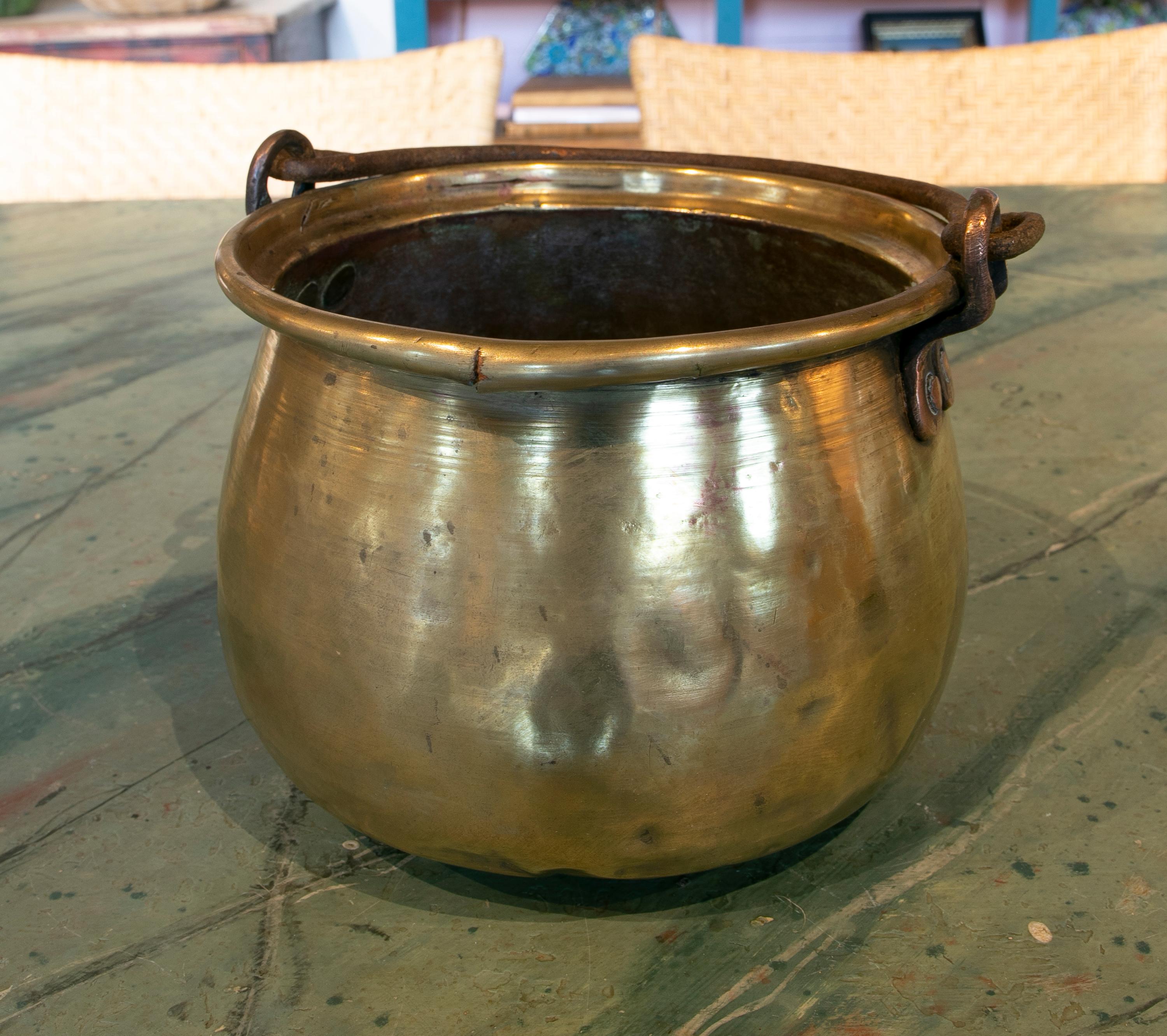 1930s Spanish bronze casserole with iron handle.