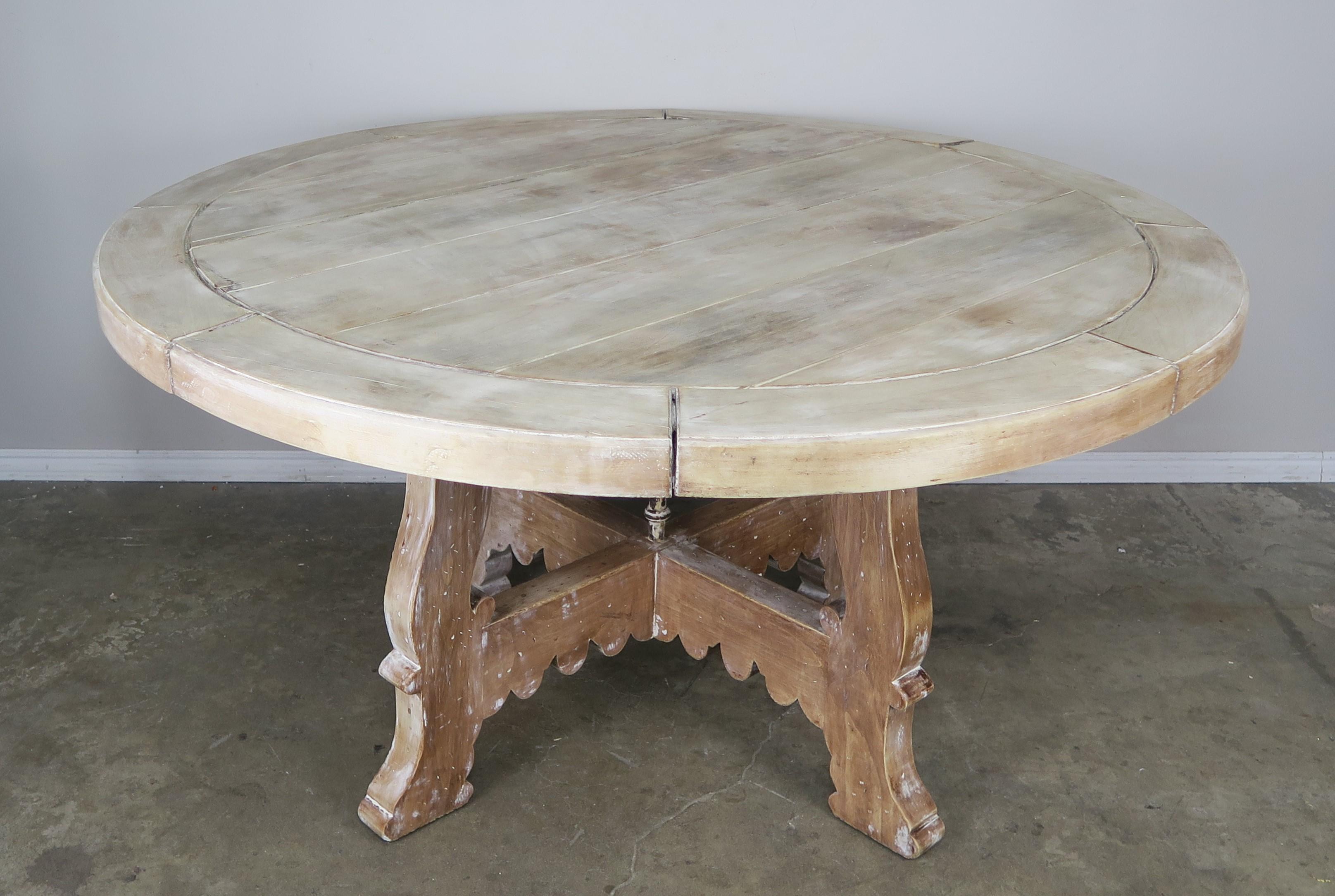 1930s Primitive style bleached walnut and iron round shaped dining table with beautiful white washed finish.
2.5 inch thick top and iron.